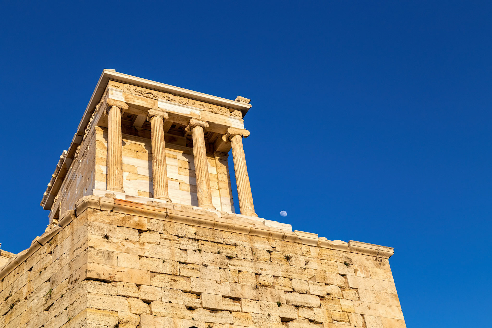 Acropolis, Athens, Greece - May 23rd 2018: The Erechtheion, an ancient Greek temple, stands on the north side of the Acropolis, showcasing Ionic architecture.