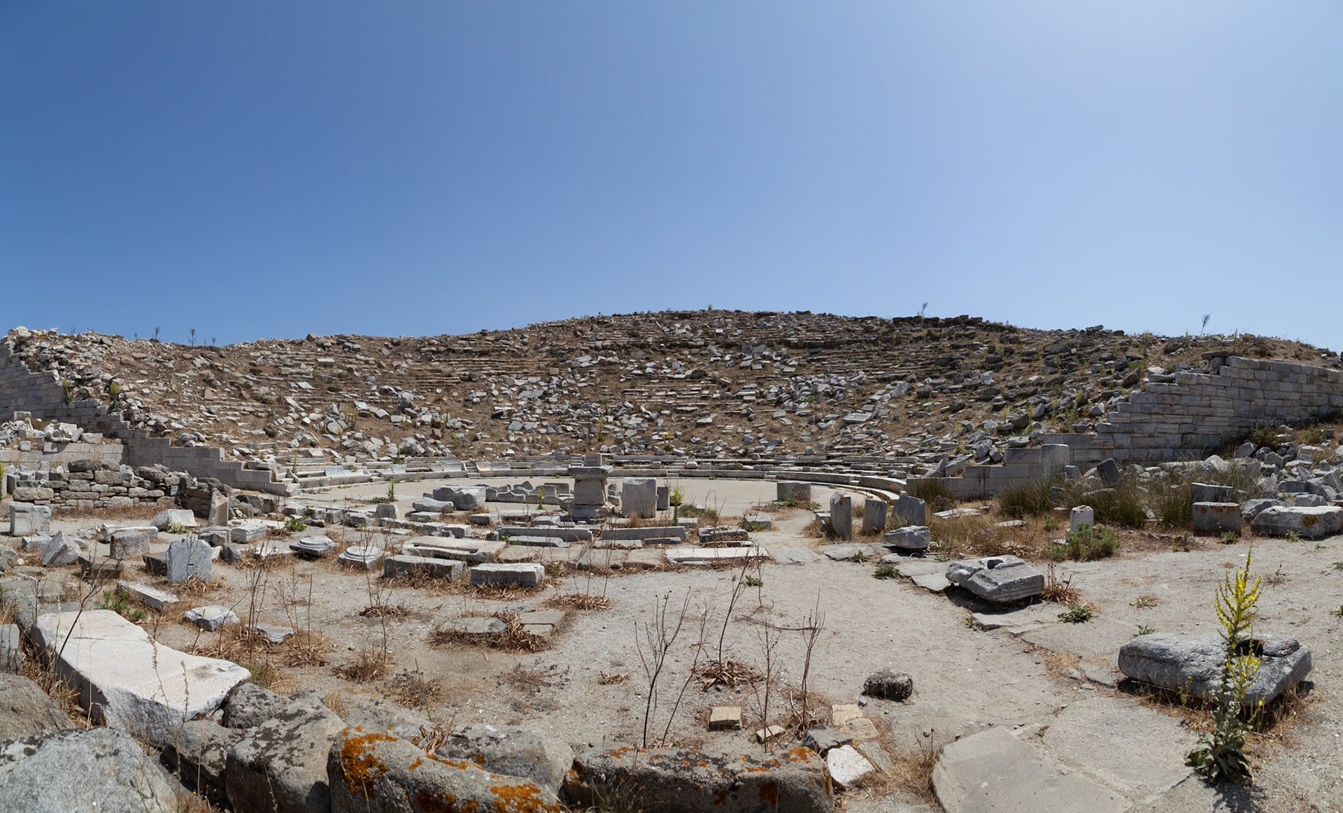 Delos, Greece - May 22nd 2018: The ancient Theatre of Delos, built in the 3rd century BC, is seen in ruins. It once held 6,500 spectators.