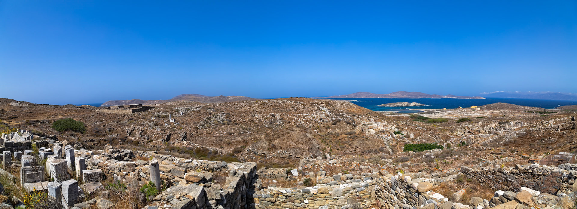 Delos, Greece - May 22nd 2018: Ruins of ancient buildings and structures are seen on the island of Delos, a UNESCO World Heritage site, showcasing its rich history and archaeological significance.