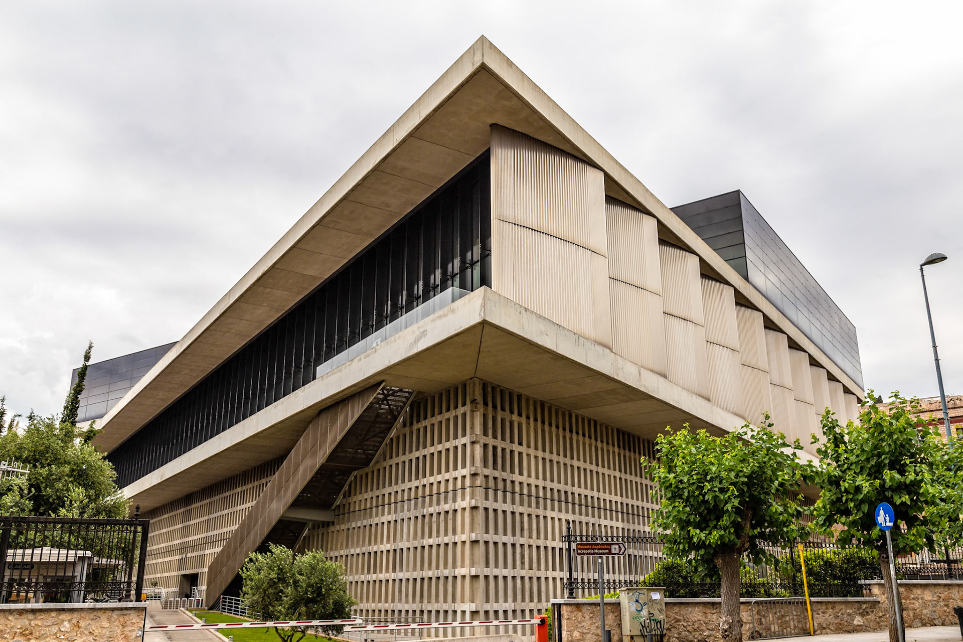 Athens, Greece - May 23rd 2018: A view of the Acropolis Museum, designed by Bernard Tschumi, showcasing ancient Greek artifacts and history.