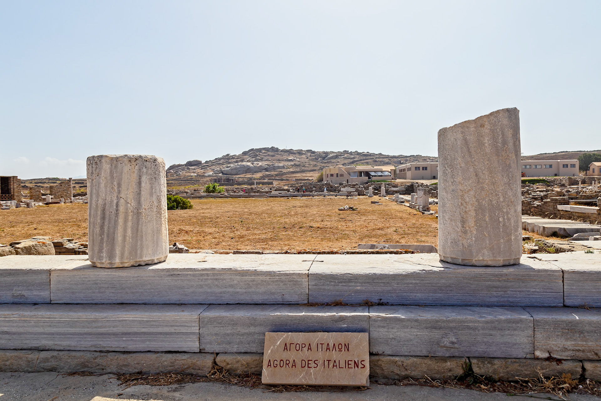 Delos, Greece - May 22nd 2018: Ruins of the Agora of the Italians, a marketplace built by Italian merchants on the island of Delos in the 2nd century BC.