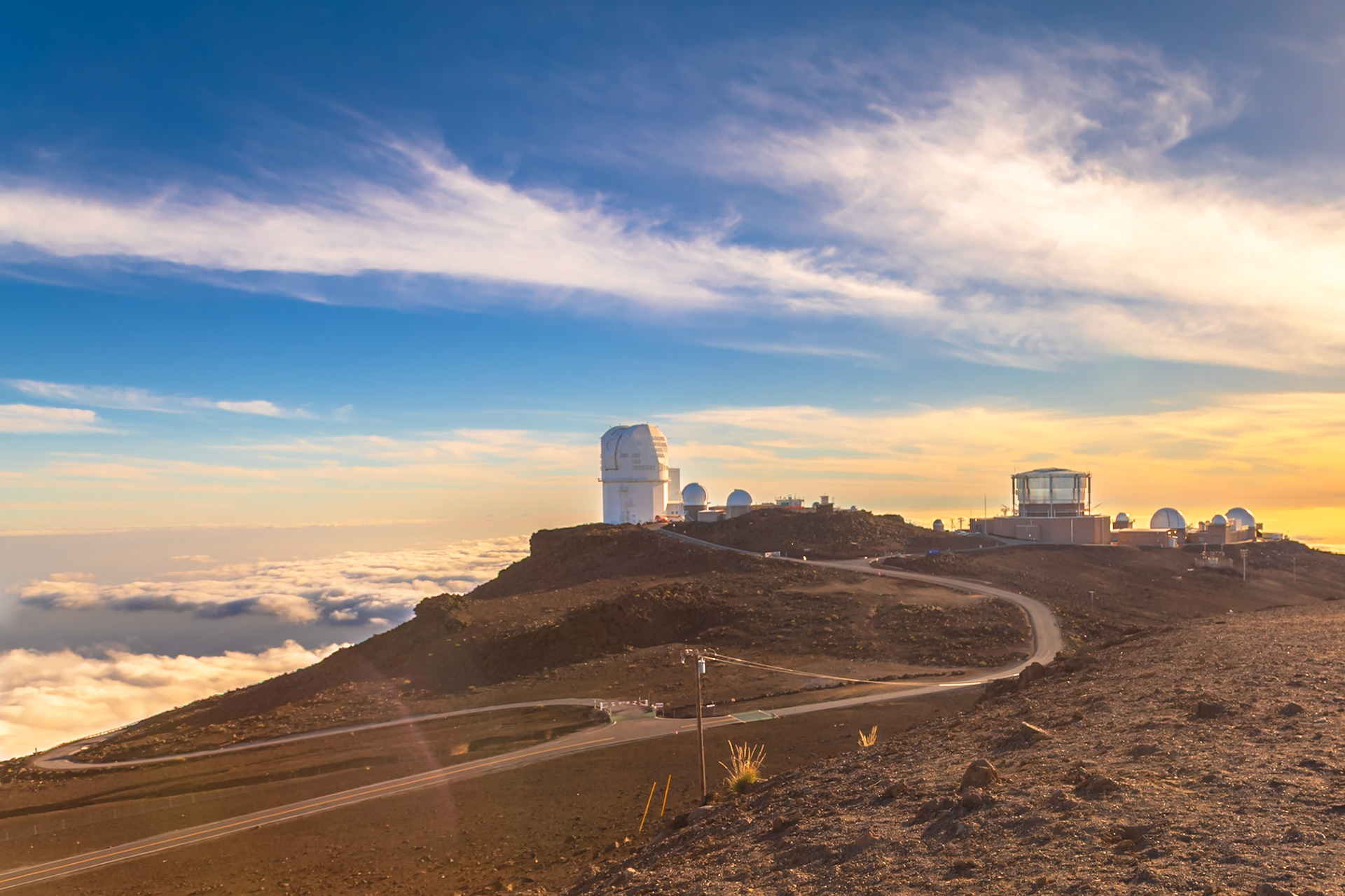 Haleakala, Maui, Hawaii - April 10th 2022: The Haleakala Observatory sits atop the volcano, used by scientists to study the cosmos due to the clear air and high altitude.