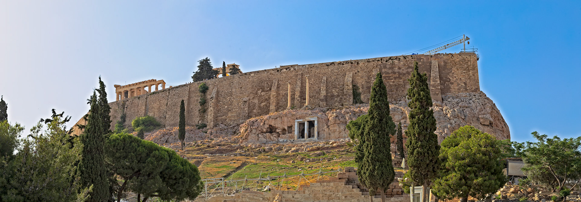 Acropolis, Athens, Greece - May 23rd 2018: A view of the Acropolis, a historic citadel located on a rocky outcrop above the city of Athens, Greece.