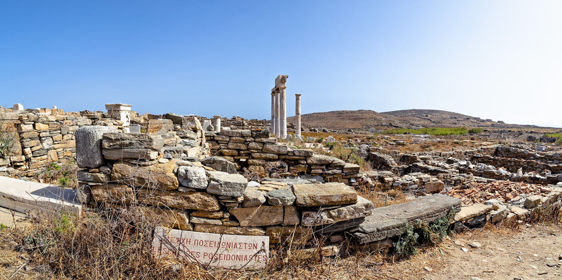 Delos, Greece - May 22nd 2018: Ruins of the ancient city of Delos, a UNESCO World Heritage site, showcase the island's rich history and archaeological significance.