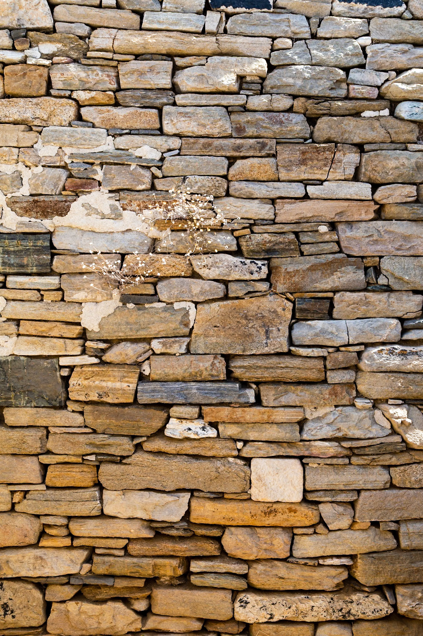 Delos, Greece - May 22nd 2018: A stone wall stands as a testament to ancient construction, showcasing the enduring architecture of Delos.