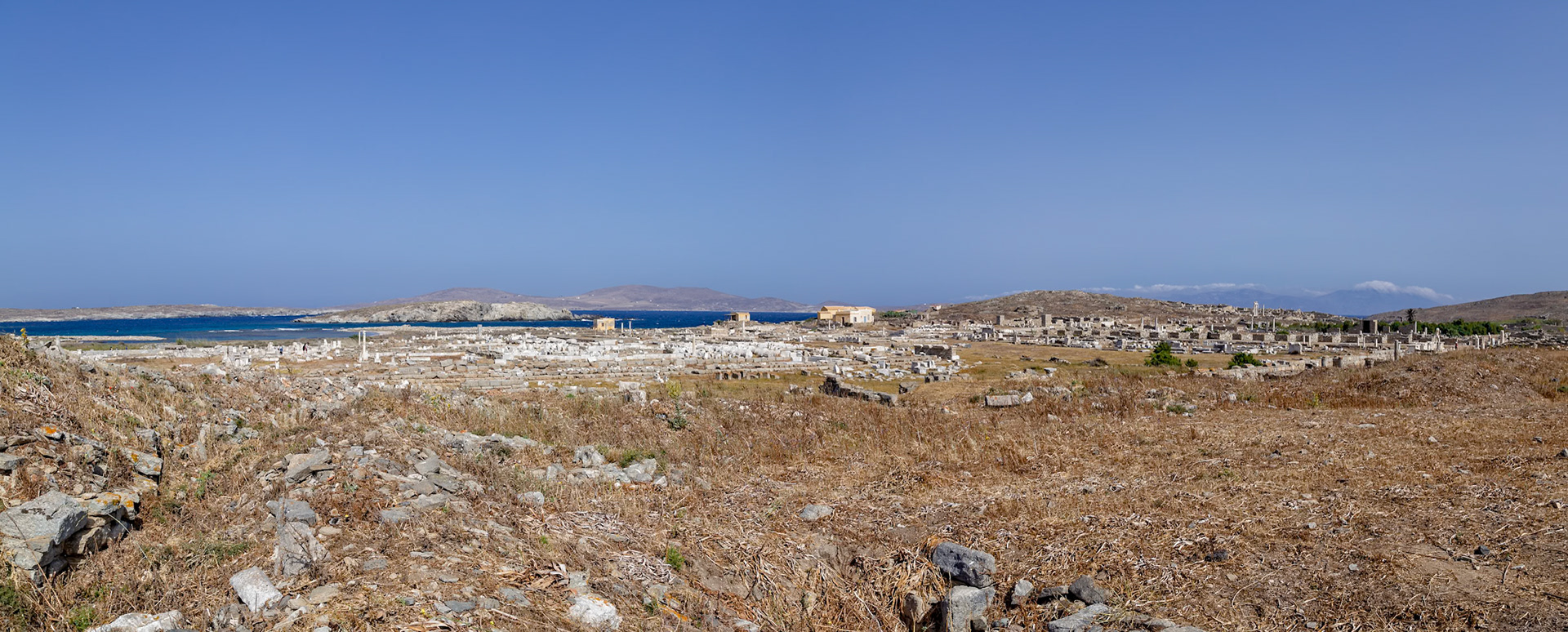 Delos, Greece - May 22nd 2018: A panoramic view of the ancient ruins of Delos, a Greek island and archaeological site, showcasing its historical significance and cultural heritage.