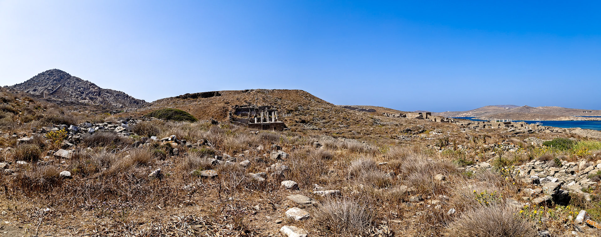 Delos, Greece - May 22nd 2018: A panoramic view of the ancient ruins on Delos Island, showcasing the historical significance and archaeological remains of this Greek island.