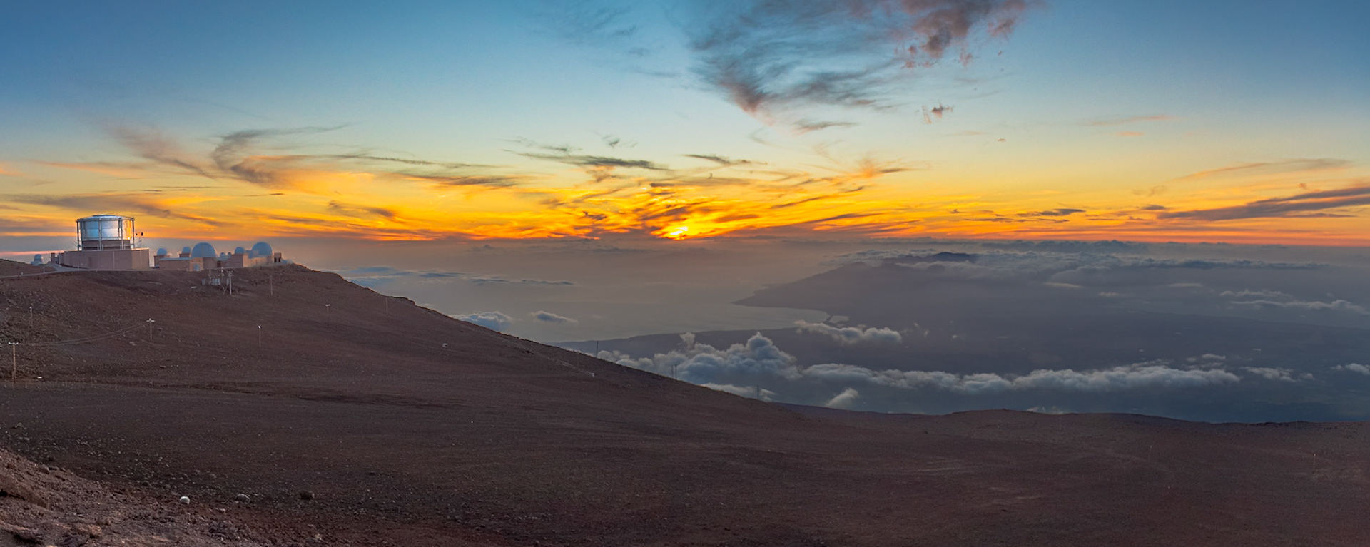 Haleakala, Maui, Hawaii - April 10th 2022: A sunrise over the Haleakala Observatory. Scientists use the telescopes to study the sun and stars.