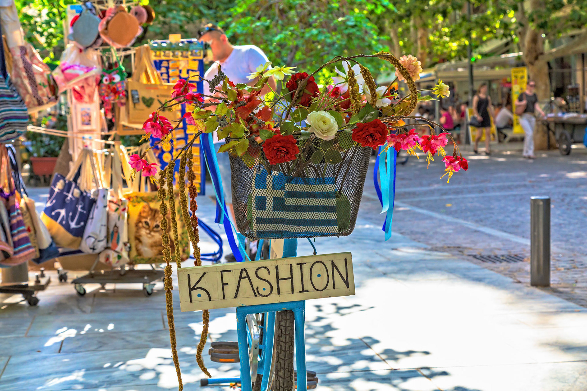 Athens, Greece - May 23rd 2018: A "K Fashion" bike with flowers in the basket is parked on the street, advertising the shop to passersby.