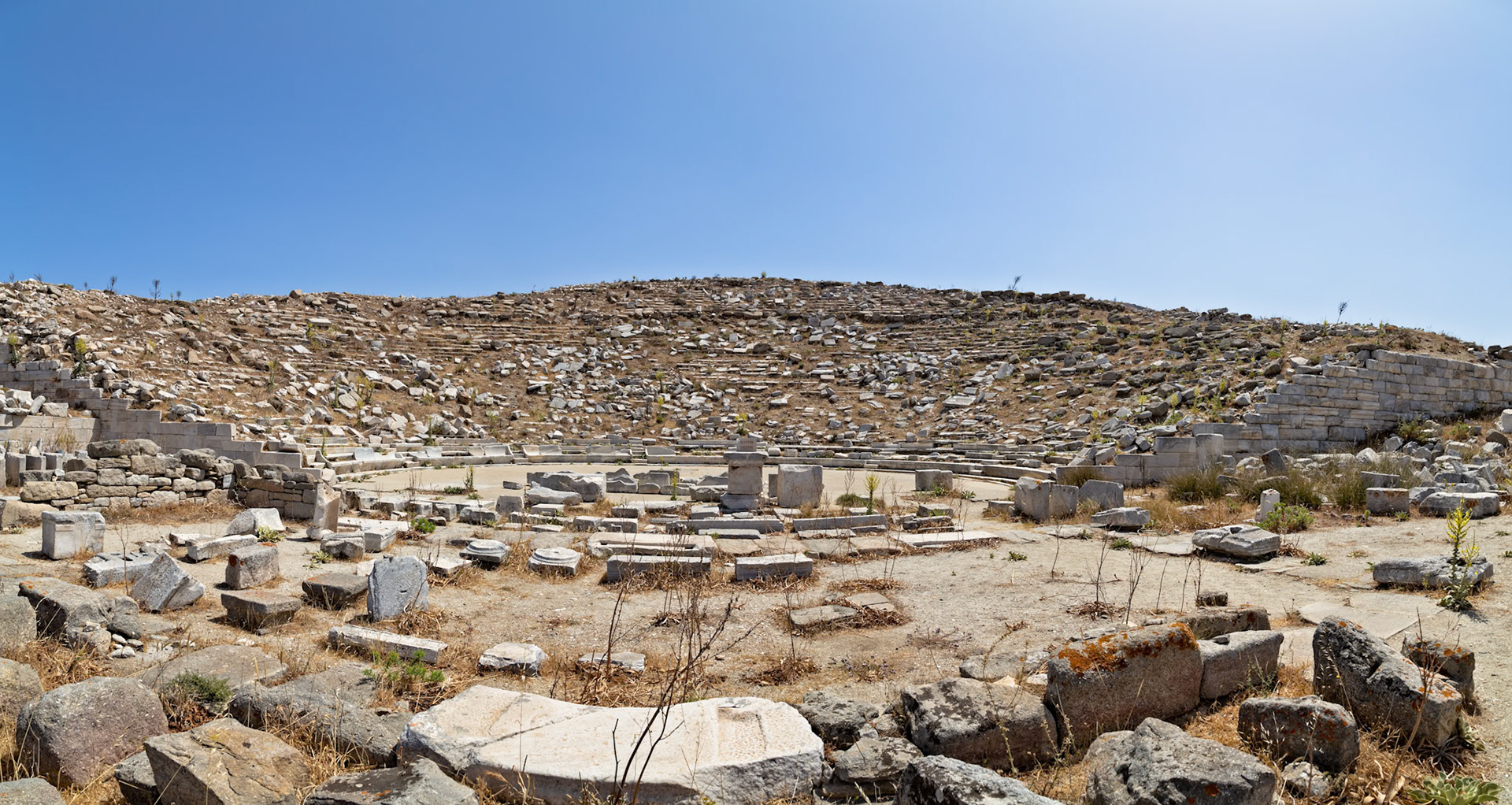 Delos, Greece - May 22nd 2018: The ancient Theatre of Delos, built in the 3rd century BC, is seen in ruins. It once held 6,500 spectators for dramatic performances.