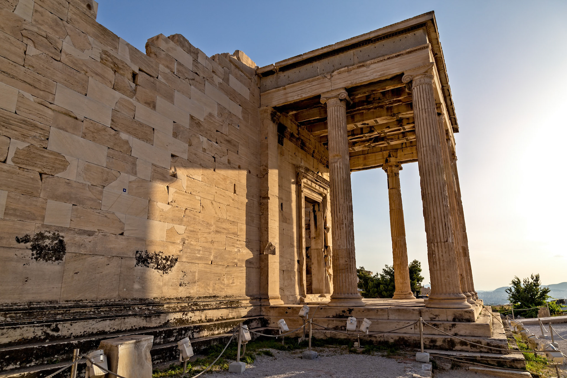 Acropolis, Athens, Greece - May 23rd 2018: The Erechtheion, an ancient Greek temple on the north side of the Acropolis, is viewed on a sunny day.