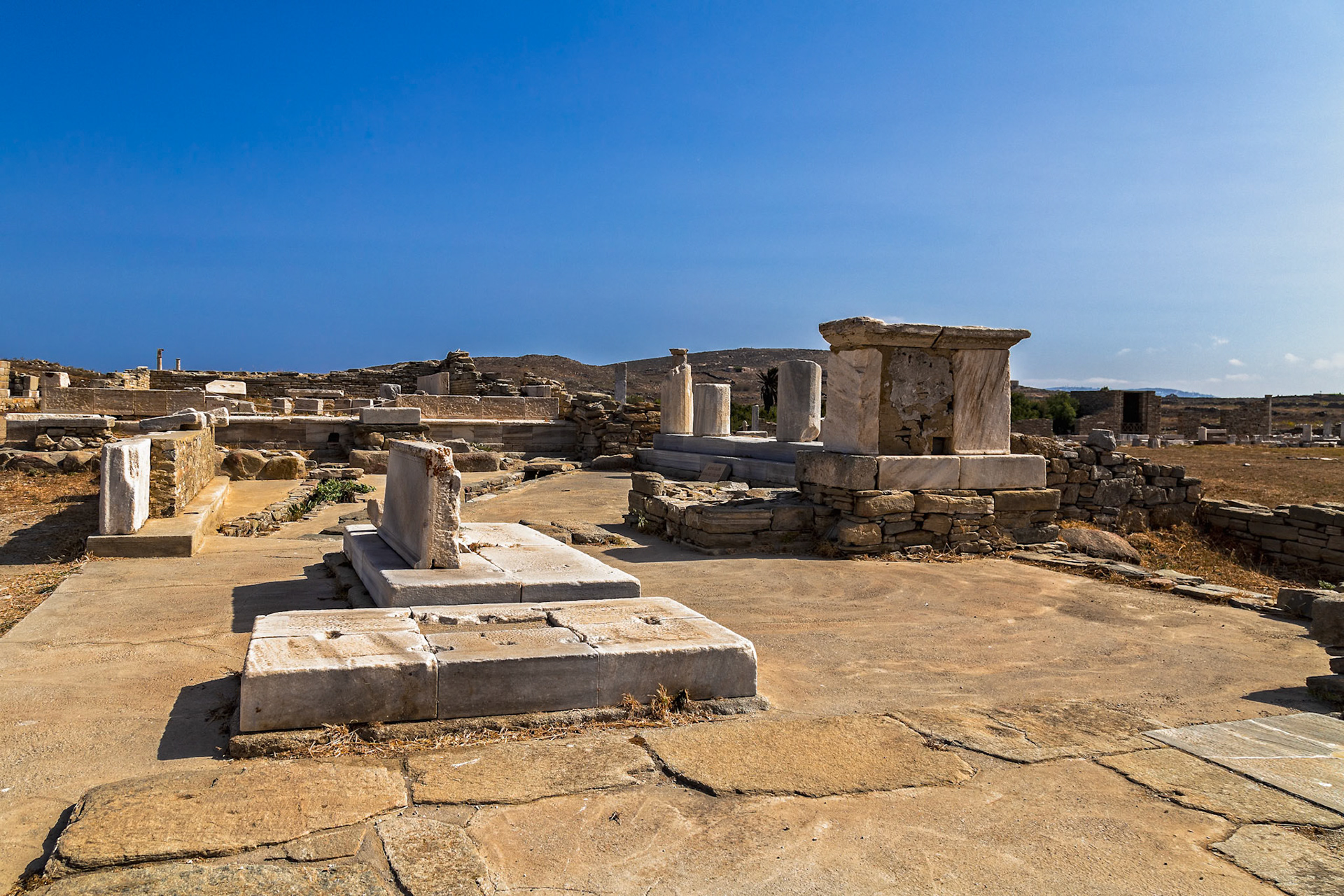 Delos, Greece - May 22nd 2018: Ancient ruins stand as a testament to Delos's rich history as a religious and commercial center in the Aegean Sea.