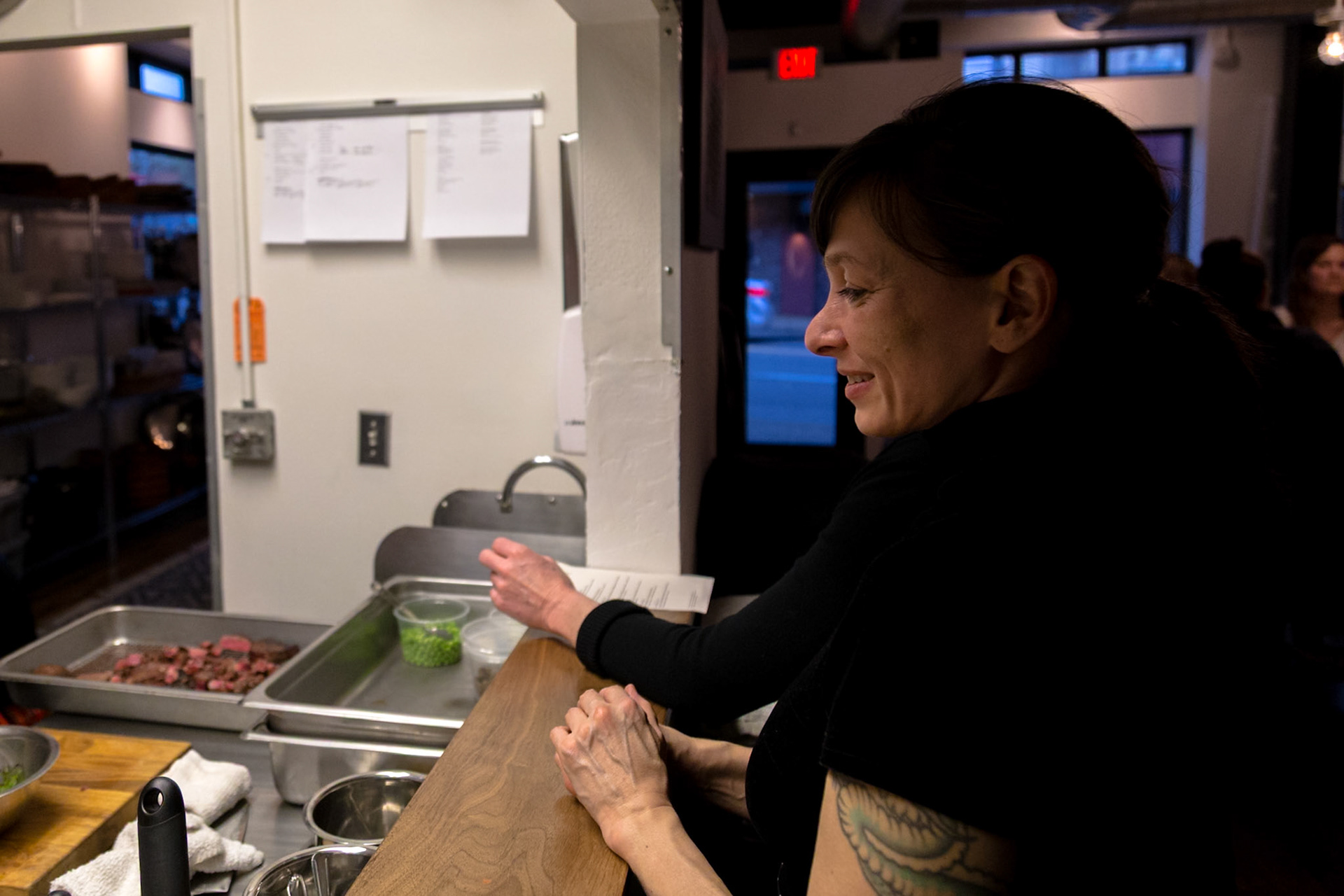 Fog Lark, Portland, Oregon - April 6th 2018: A chef preps ingredients in a professional kitchen, possibly for a special event or catering order.