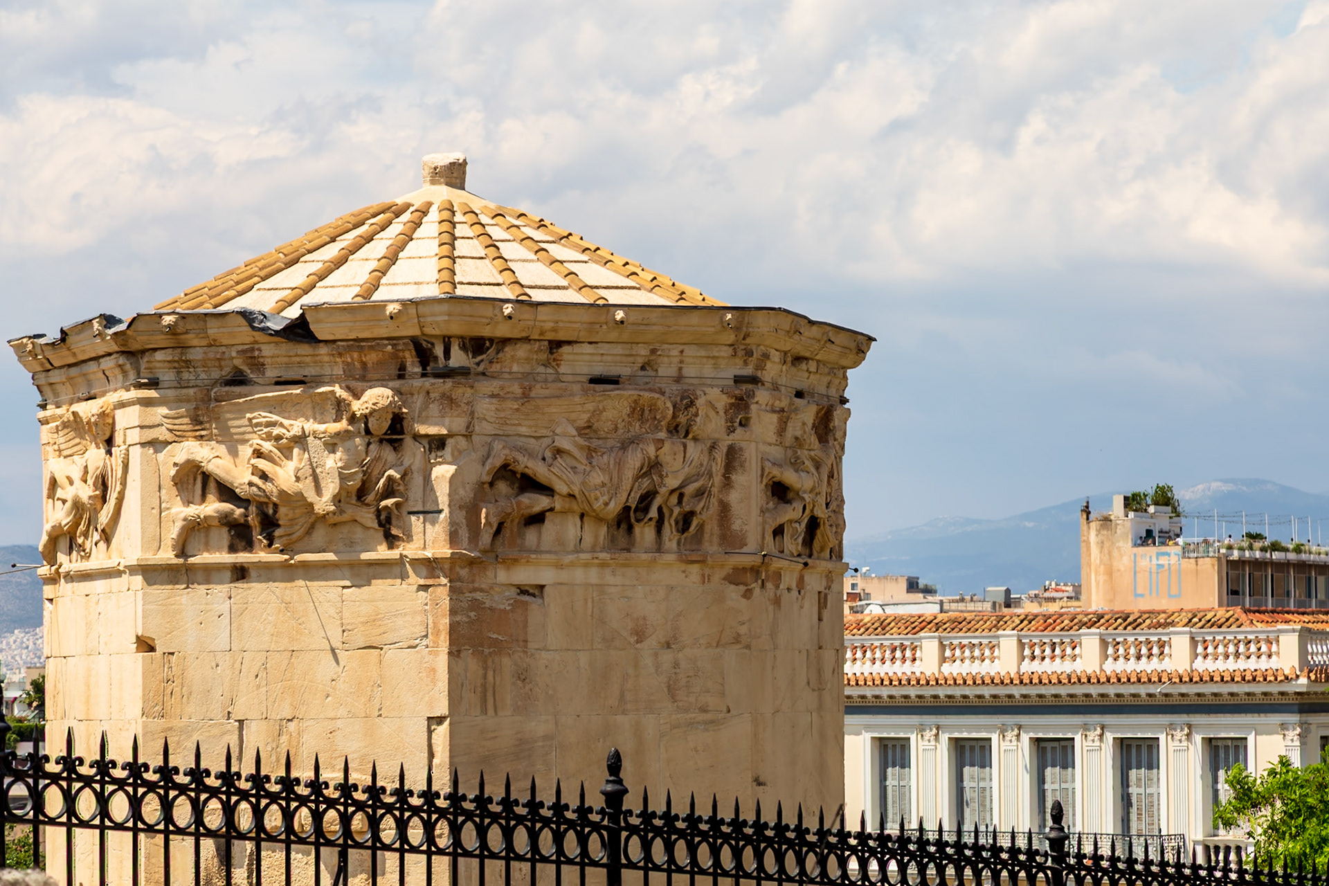 Athens, Greece - May 23rd 2018: The Tower of the Winds, an ancient clocktower, stands as a testament to Greek ingenuity and architectural prowess.
