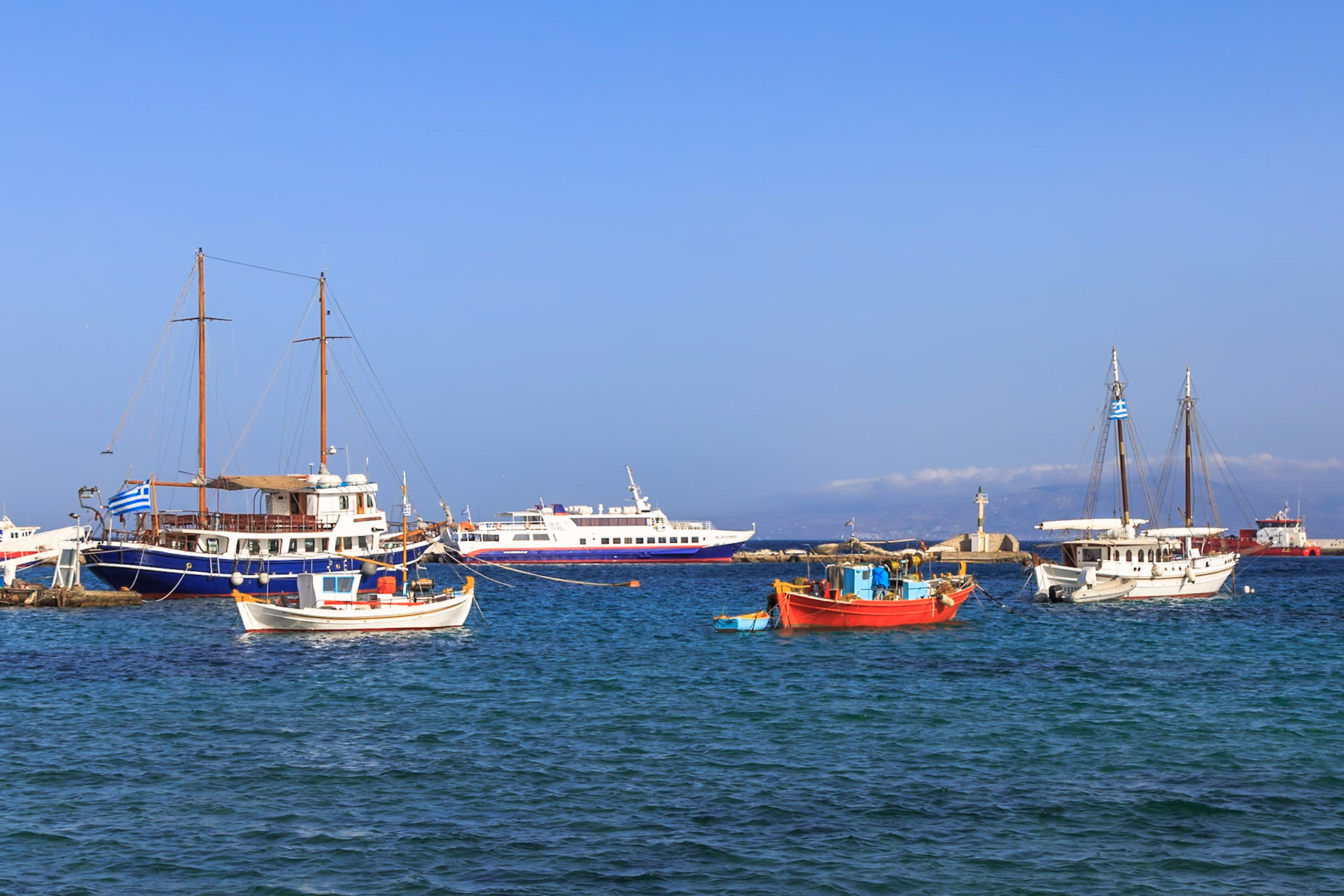 Mykonos, Greece - May 23rd 2018: Boats are moored in the harbor, likely for tourism or fishing, showcasing the island's maritime culture.