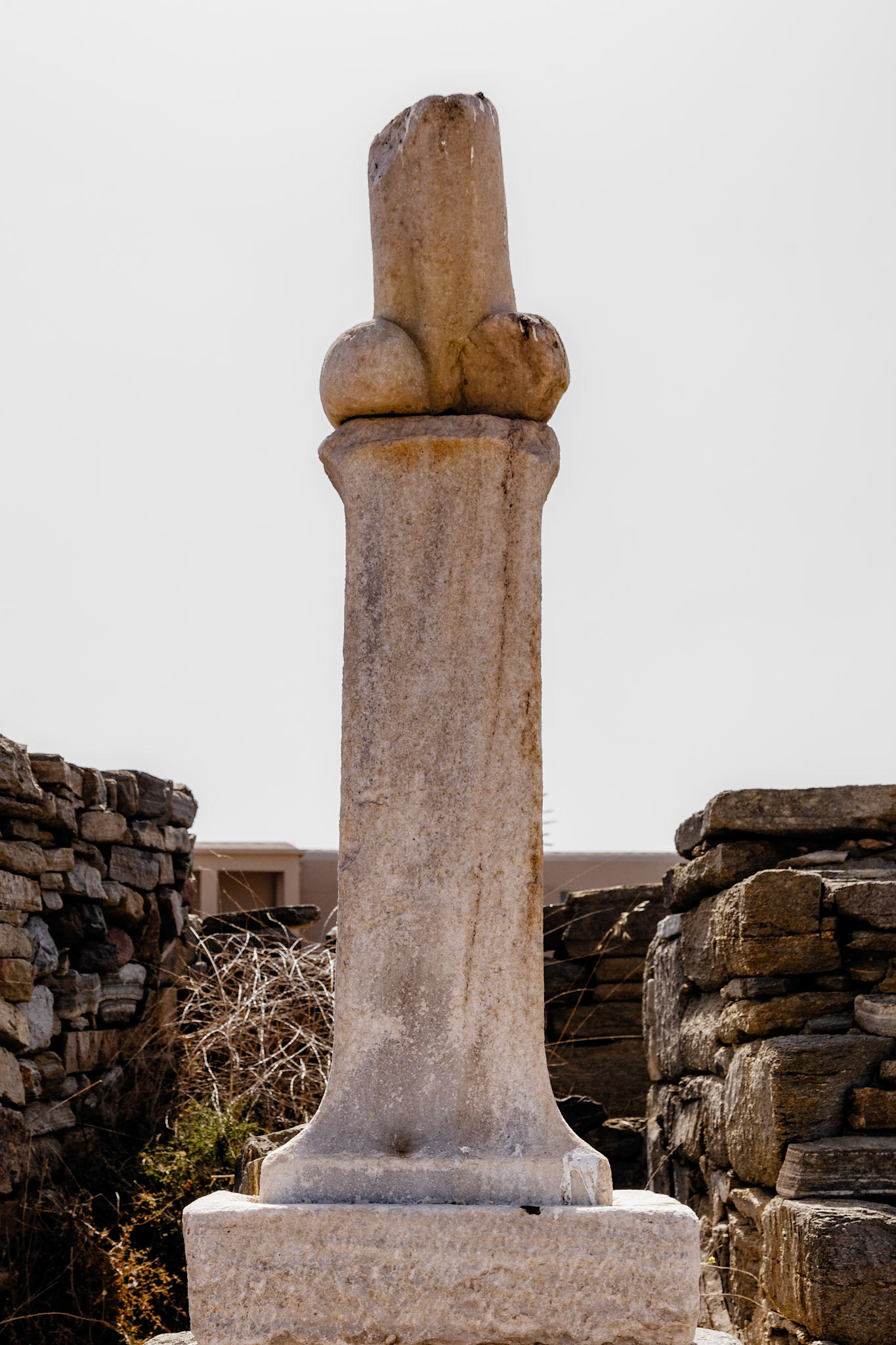 Delos, Greece - May 22nd 2018: A phallus sculpture stands on Delos, an island known for its mythological significance as the birthplace of Apollo and Artemis.