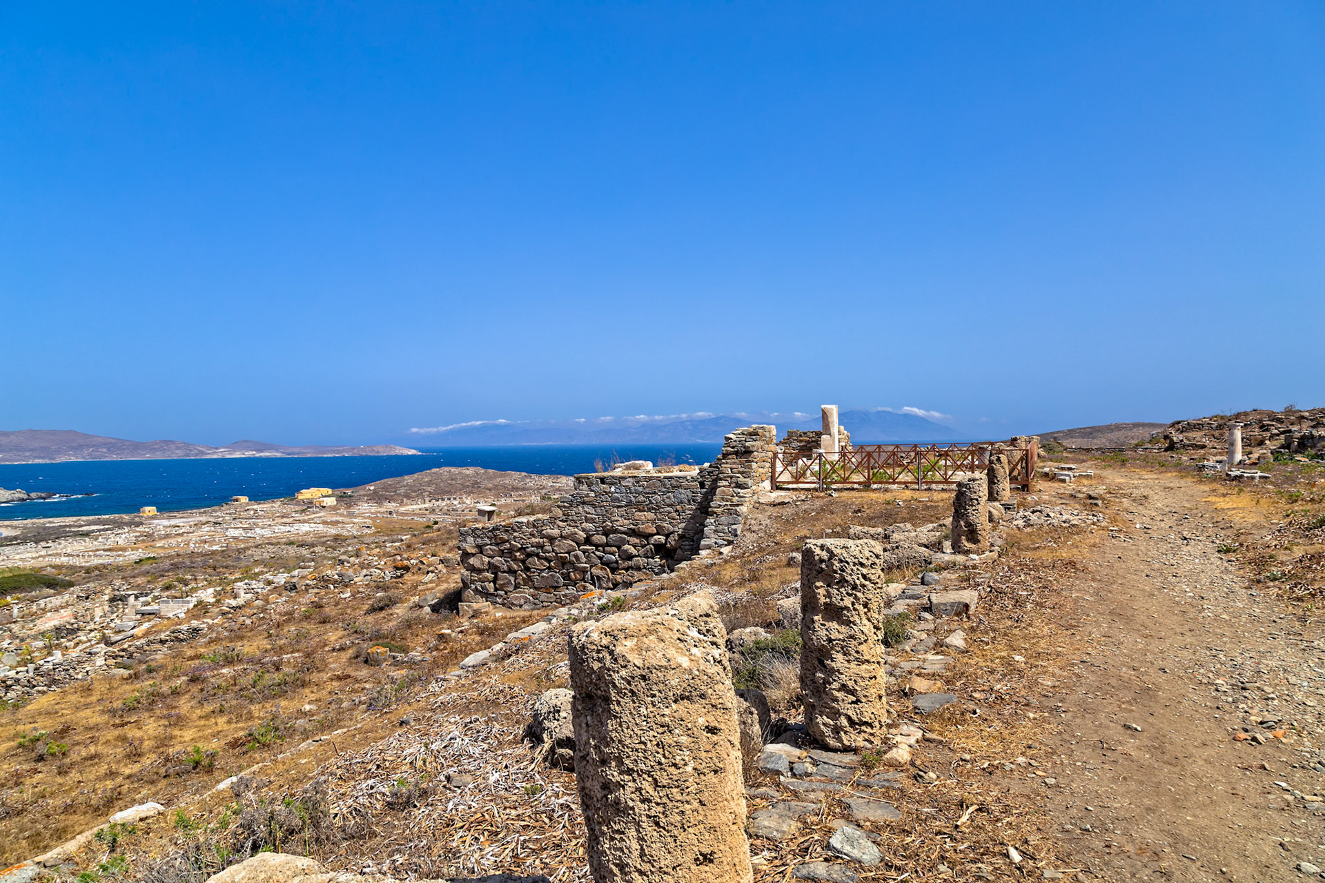 Delos, Greece - May 22nd 2018: Ancient ruins stand on Delos, a Greek island and archaeological site. The ruins offer a glimpse into the island's rich history.
