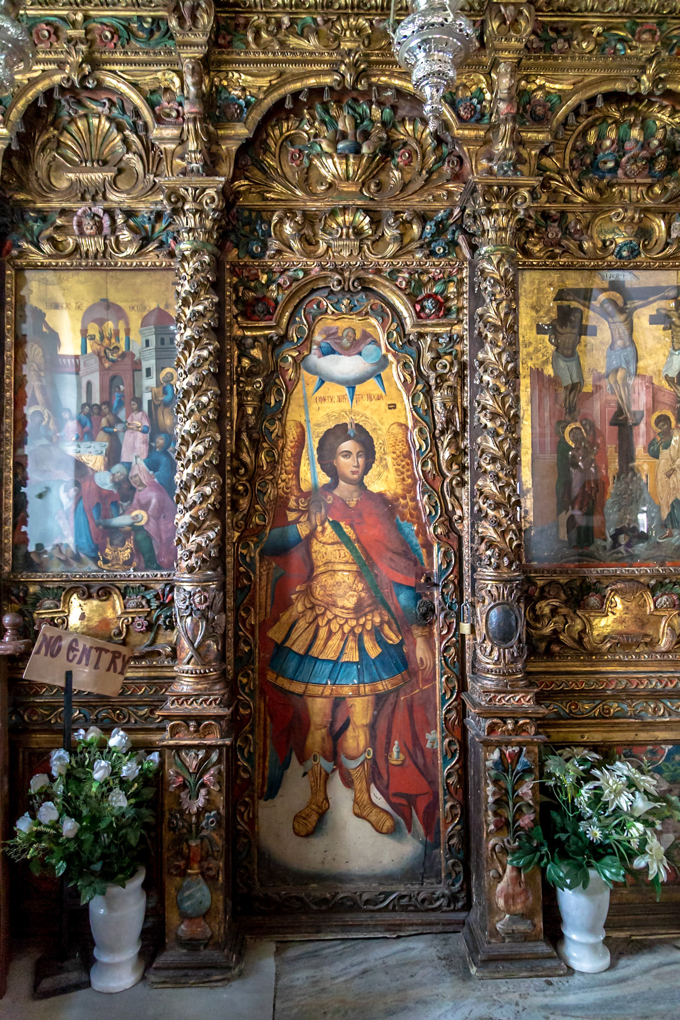 Mykonos, Greece - May 22nd 2018: A detailed view of the Panagia Tourliani Monastery's ornate iconostasis, showcasing religious art and craftsmanship.