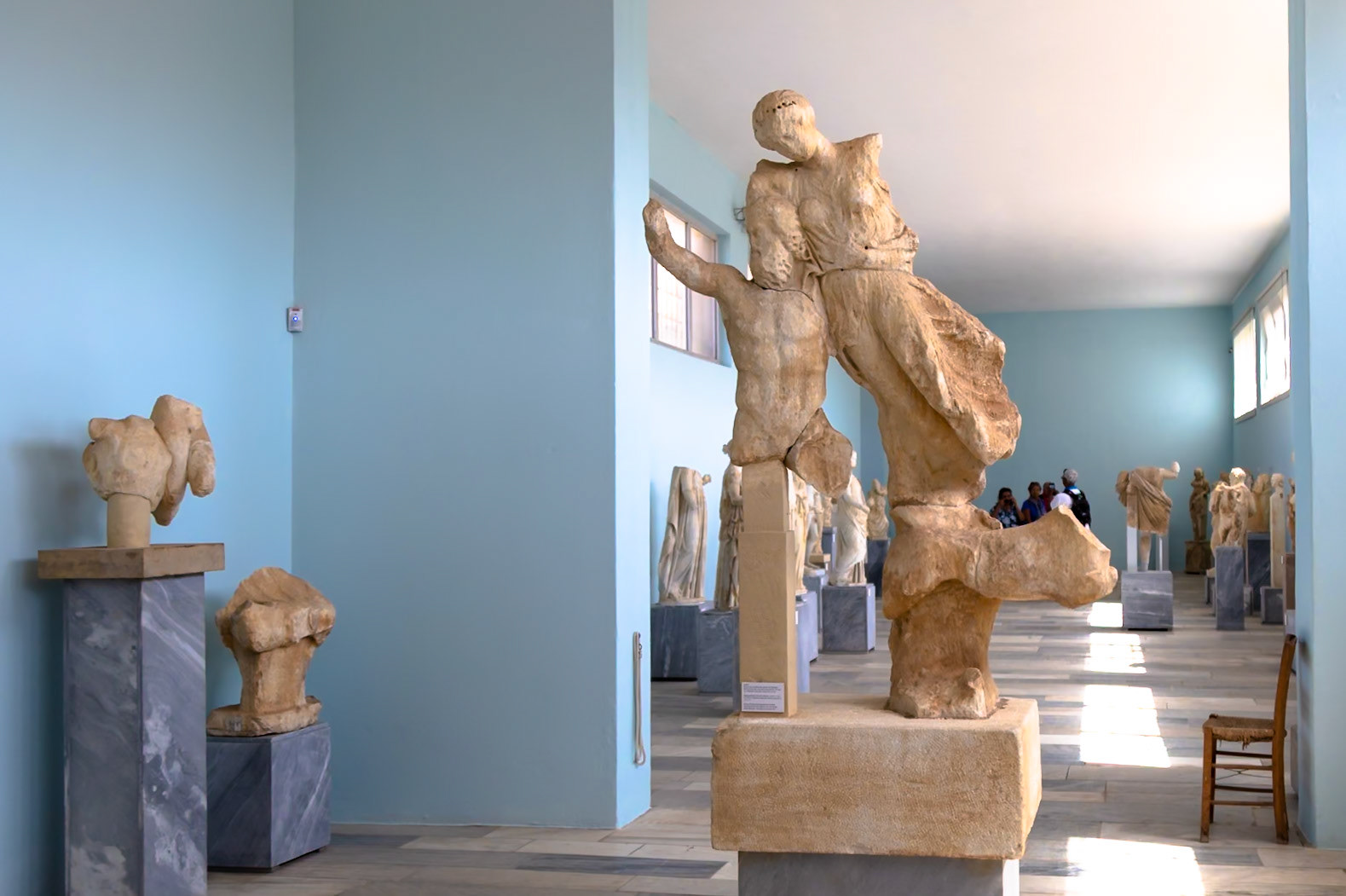 Delos, Greece - May 22nd 2018: Ancient Greek sculptures are displayed in a museum, showcasing the art and history of Delos to visitors.
