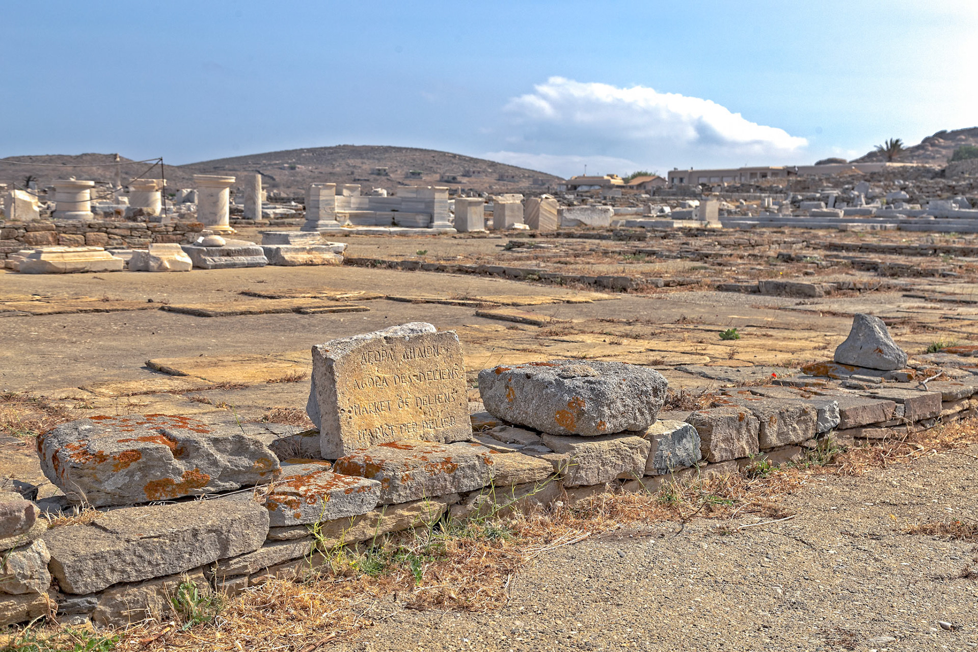 Delos, Greece - May 22nd 2018: Ruins of the Agora of the Delians, a marketplace on the island of Delos. It was a center for trade and commerce in ancient times.