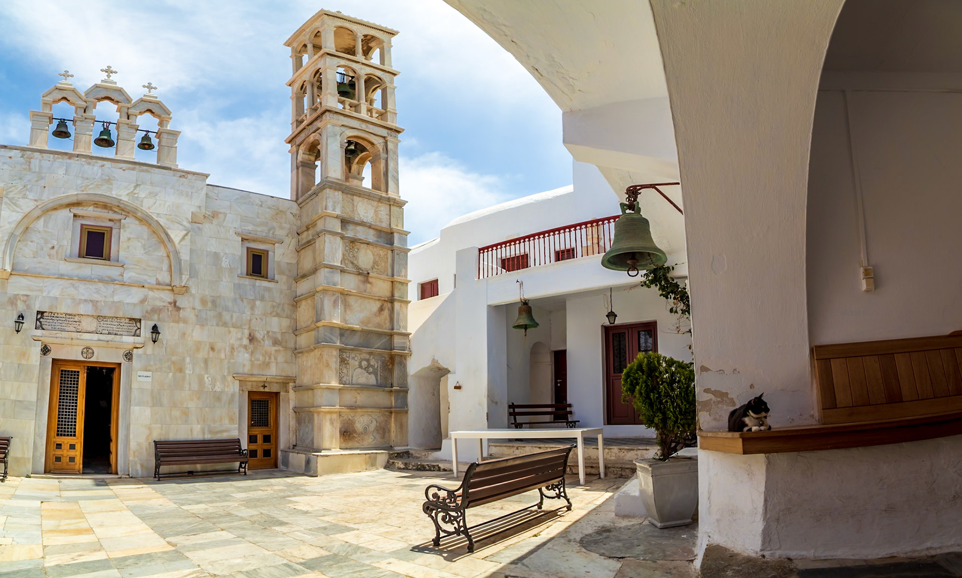 Mykonos, Greece - May 22nd 2018: A view of the iconic Paraportiani Church, showcasing its unique architecture and serene atmosphere on a sunny day.