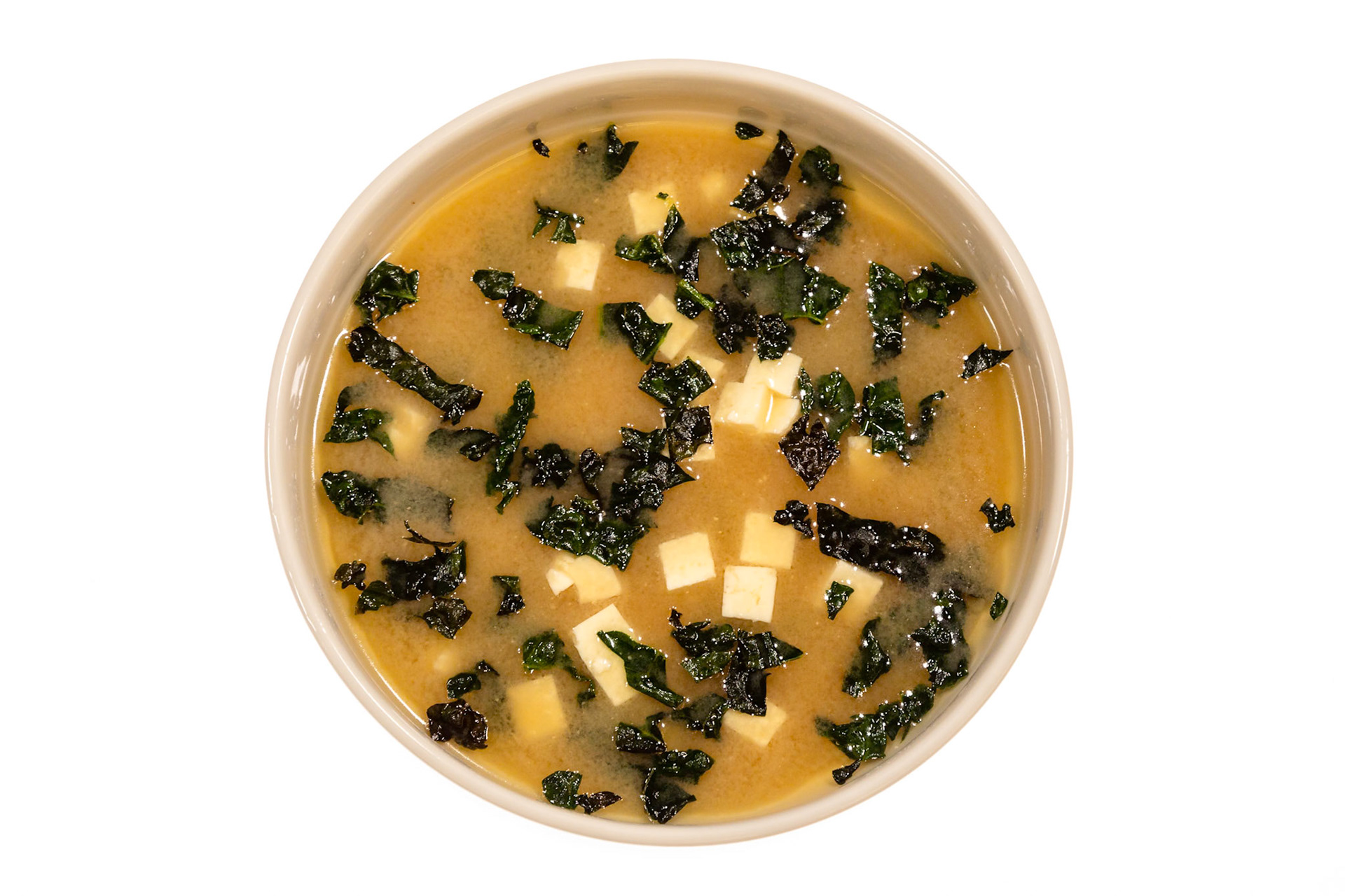 Fog Lark, Portland, Oregon - March 15th 2019: A bowl of miso soup with tofu and seaweed, a traditional Japanese dish, is served.