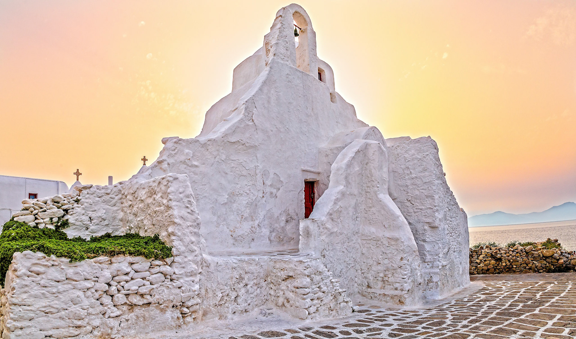 Mykonos, Greece - May 23rd 2018: Paraportiani Church, a whitewashed architectural marvel, stands as a testament to Mykonos' rich history.