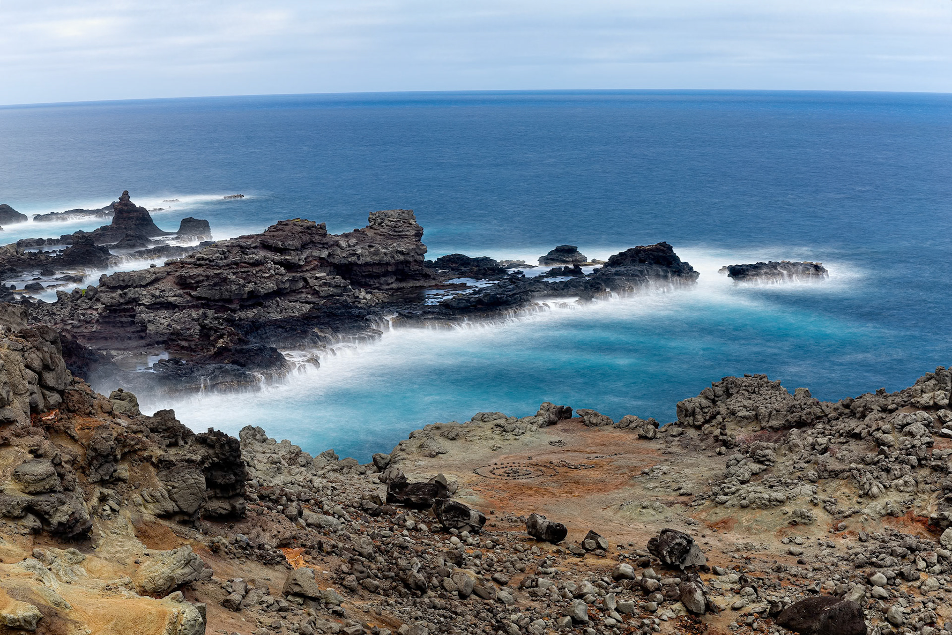 Maui, Hawaii, USA - April 9th 2022: Waves crash against the rocky shore of Maui, showcasing the island's rugged coastline and the power of the ocean.