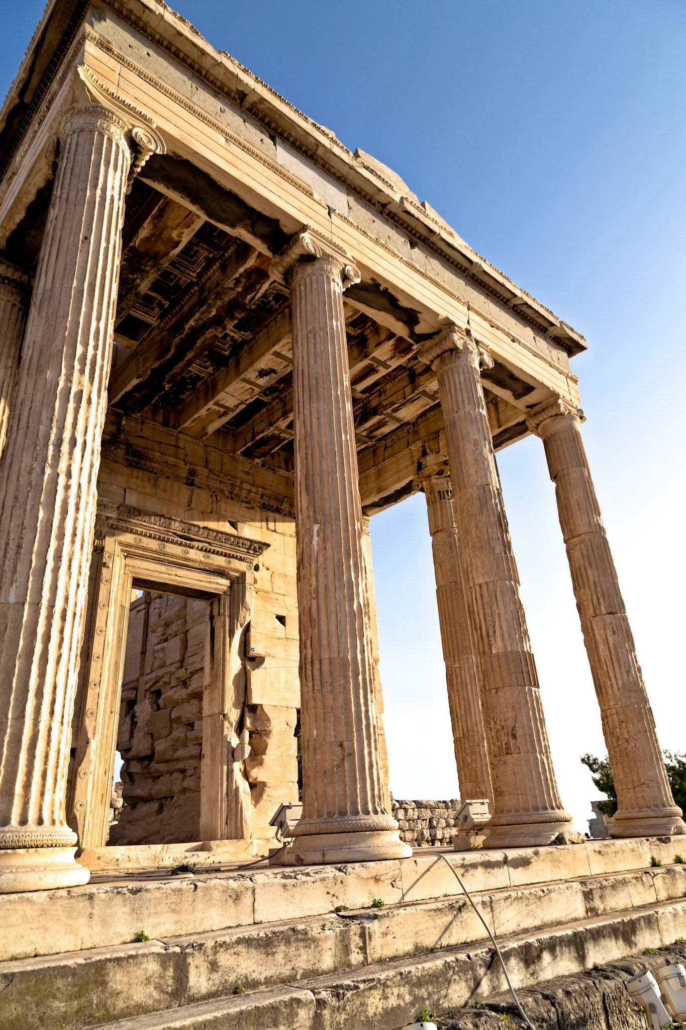 Acropolis, Athens, Greece - May 23rd 2018: The Erechtheion, an ancient Greek temple on the north side of the Acropolis, stands as a testament to history.