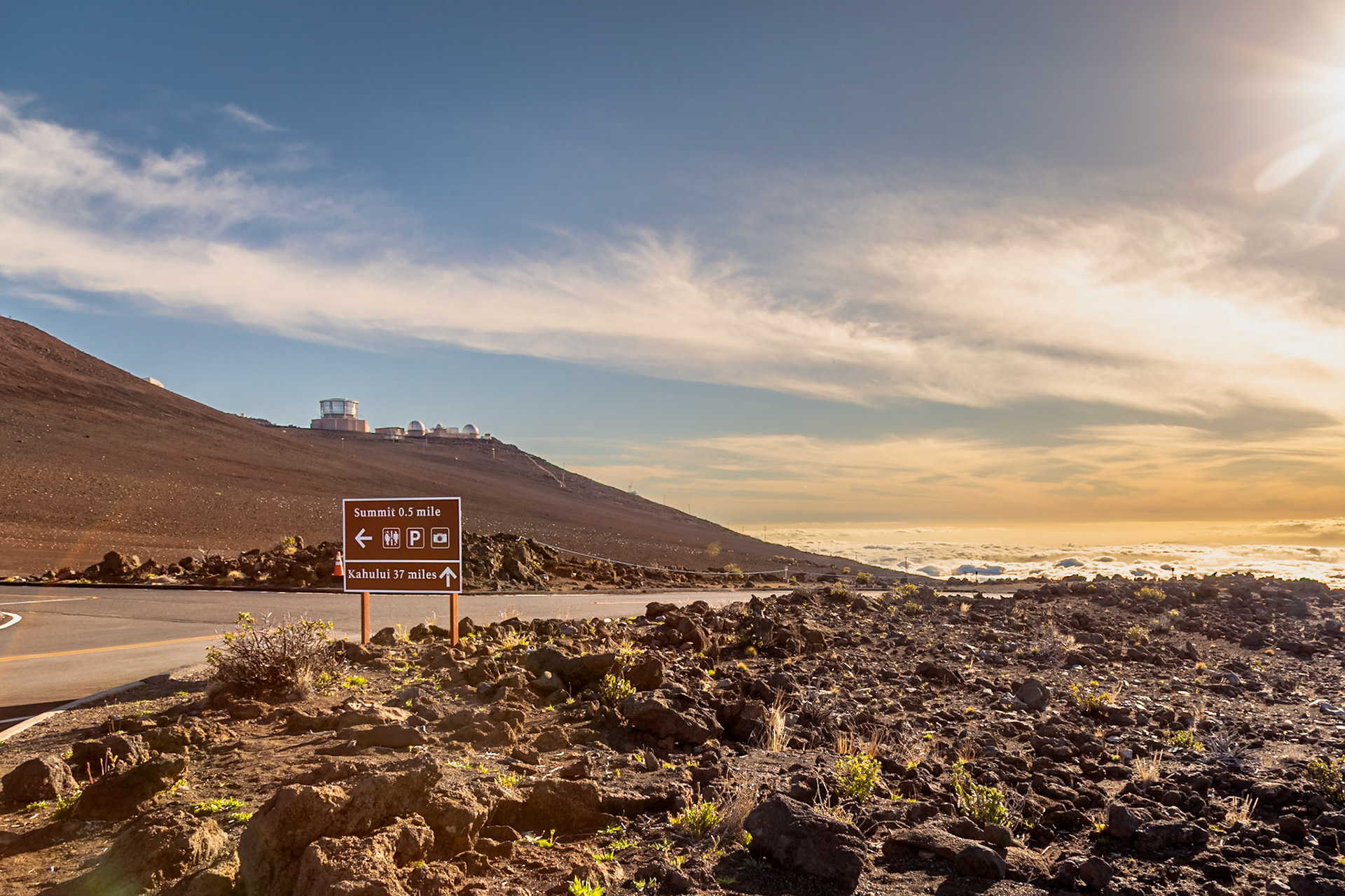 Haleakala, Maui, Hawaii - April 10th 2022: A sign points towards the summit and Kahului, guiding visitors to explore the volcanic landscape and observatories.