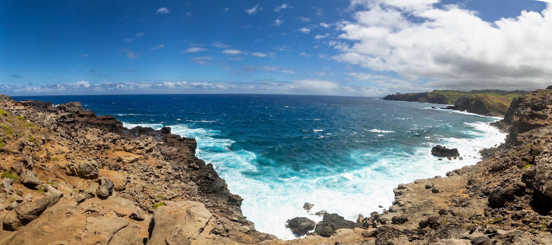 Maui, Hawaii, USA - April 9th 2022: Waves crash against the rocky coastline of Maui, showcasing the island's rugged beauty and the power of the ocean.