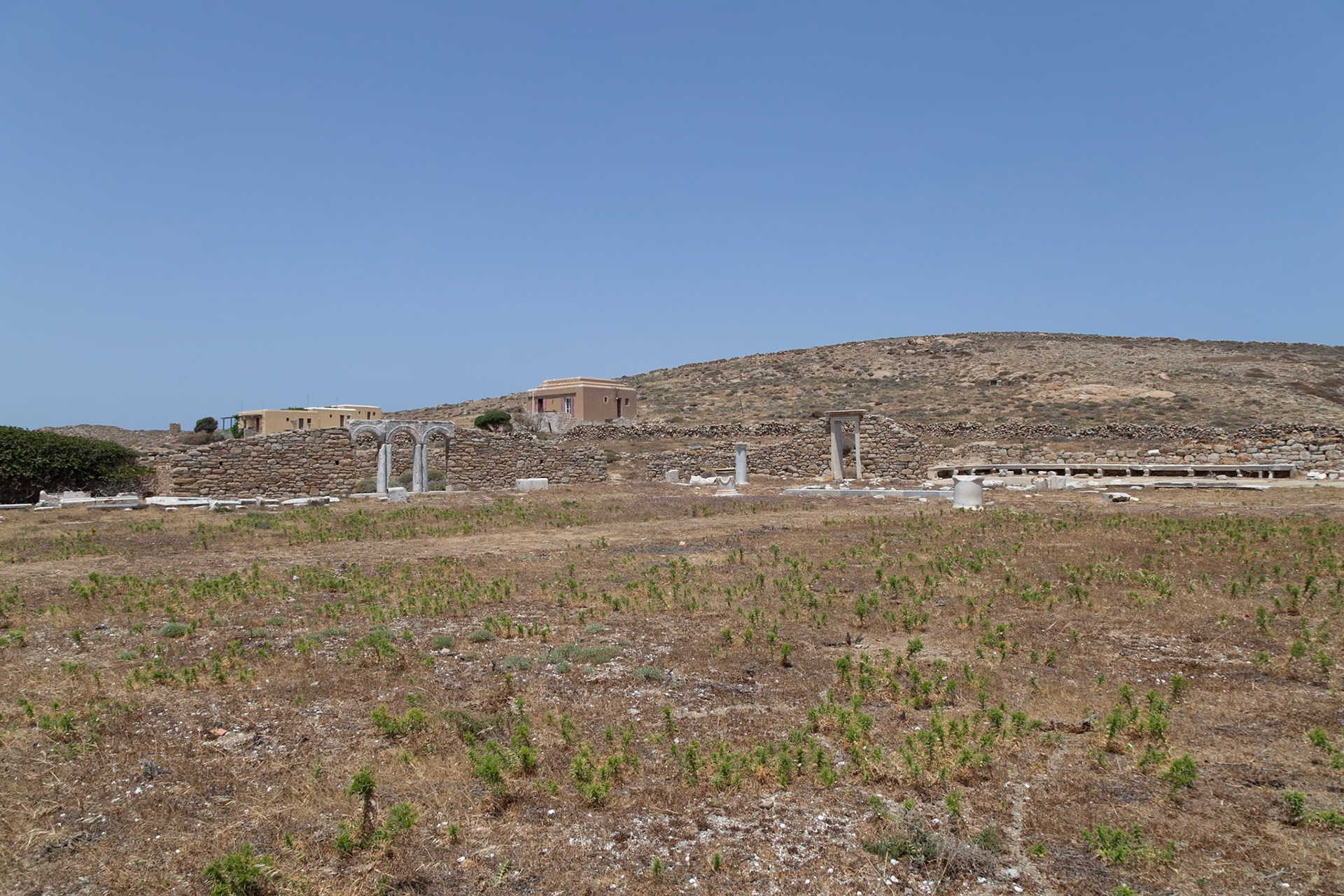 Delos, Greece - May 22nd 2018: Ruins of ancient structures stand on Delos, a Greek island and archaeological site, showcasing its rich history and cultural significance.