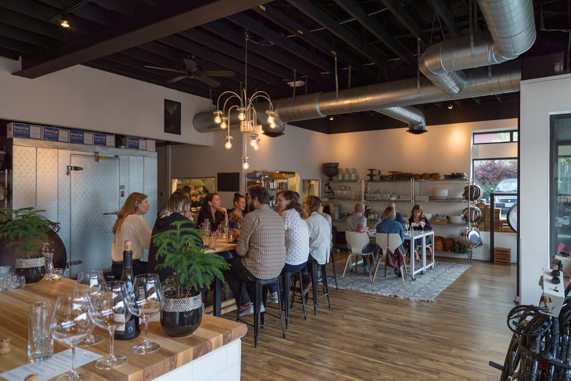 Fog Lark, Portland, Oregon - April 6th 2018: People are gathered at tables in a restaurant, possibly for a wine tasting or a private event.