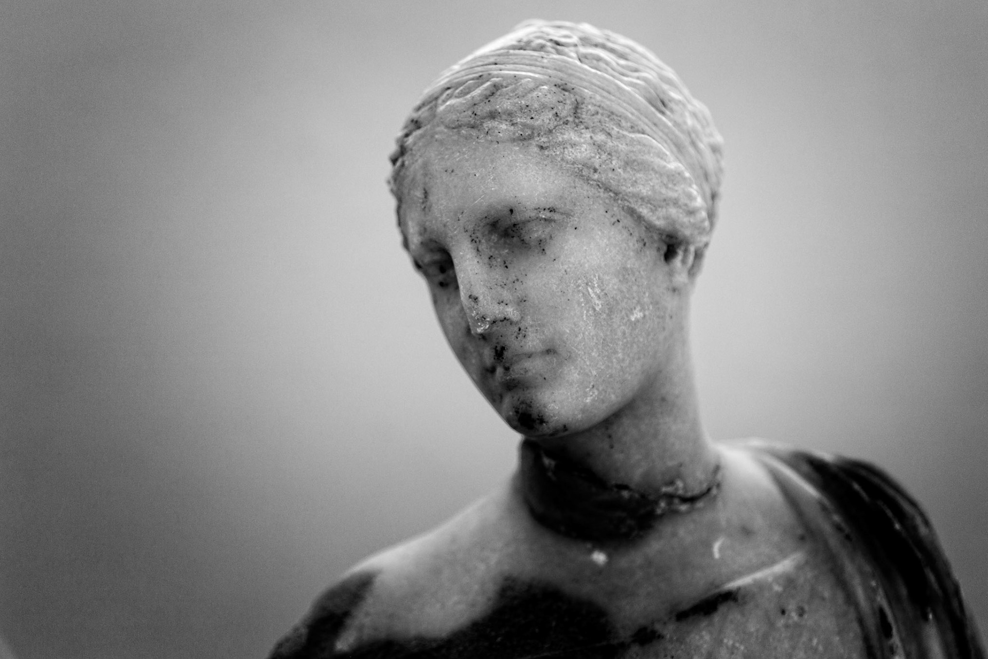 Delos, Greece - May 22nd 2018: A marble statue of a woman stands in Delos, Greece. The statue is a reminder of the island's rich history and culture.