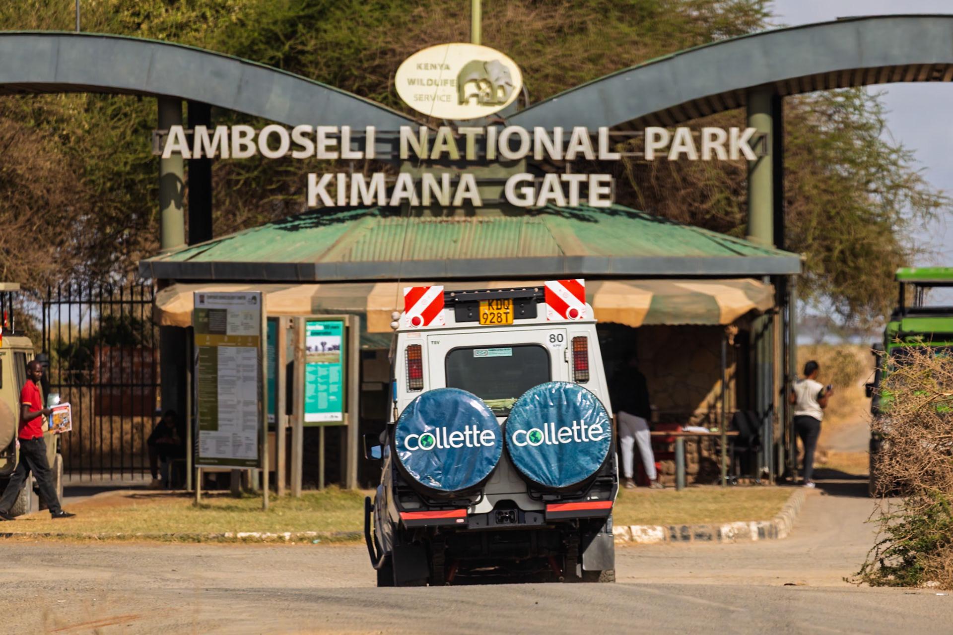 A Collette tour vehicle enters Amboseli National Park, Kenya, through Kimana Gate. Visitors check in for their safari adventure.