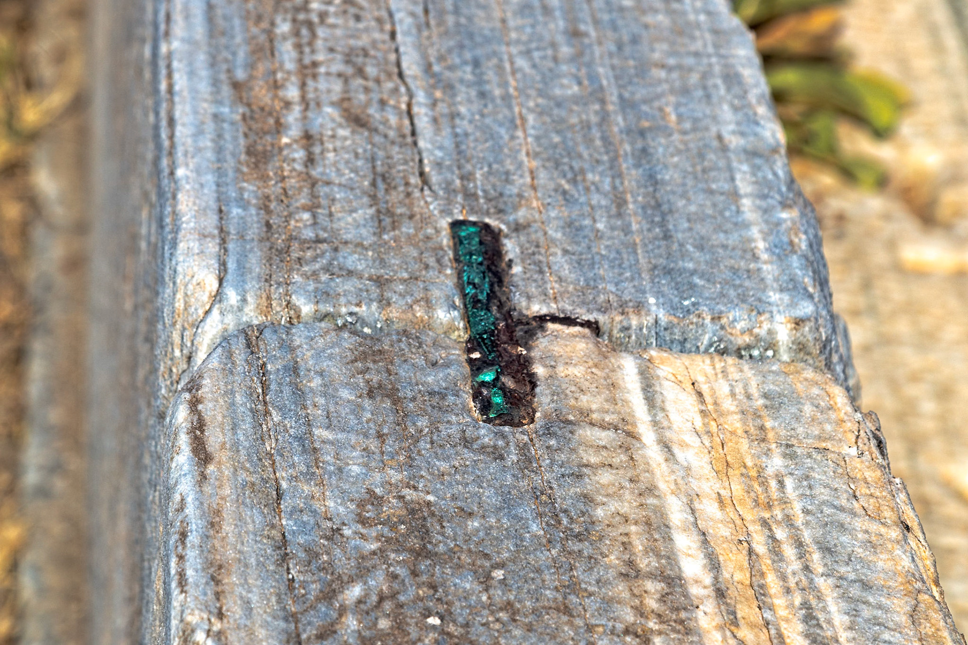 Delos, Greece - May 22nd 2018: A close-up shows a stone block with a filled mortise joint. This is an example of ancient construction techniques used on Delos.