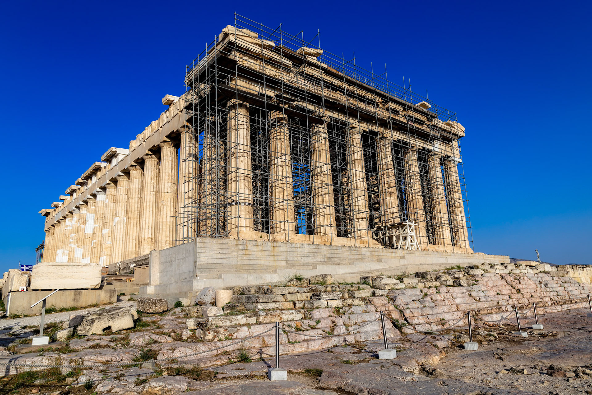 Acropolis, Athens, Greece - May 23rd 2018: The Parthenon is undergoing restoration, with scaffolding covering parts of the ancient temple.