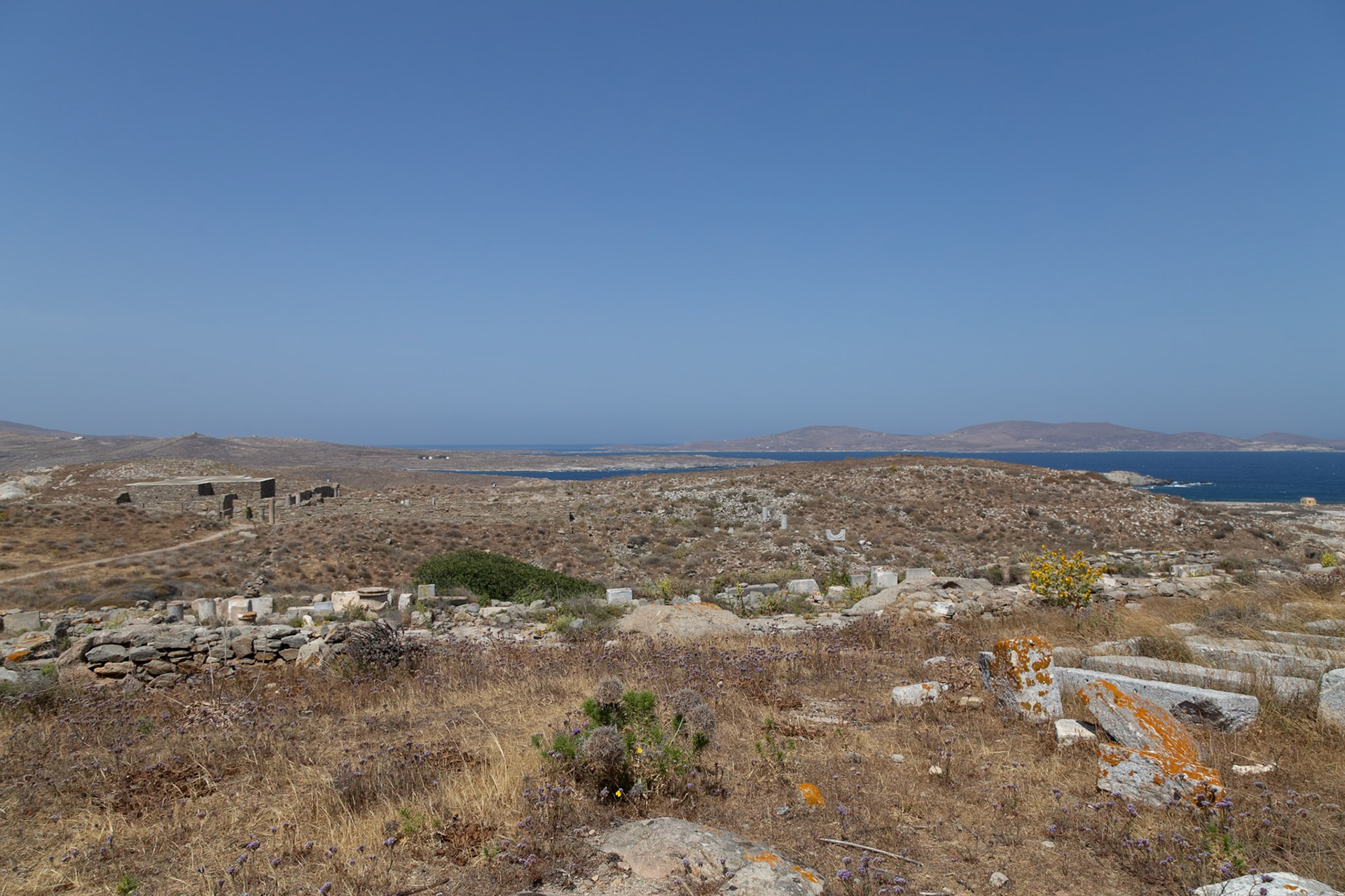 Delos, Greece - May 22nd 2018: A view of the ancient ruins on Delos Island, showcasing the historical significance and archaeological remains of this UNESCO World Heritage site.