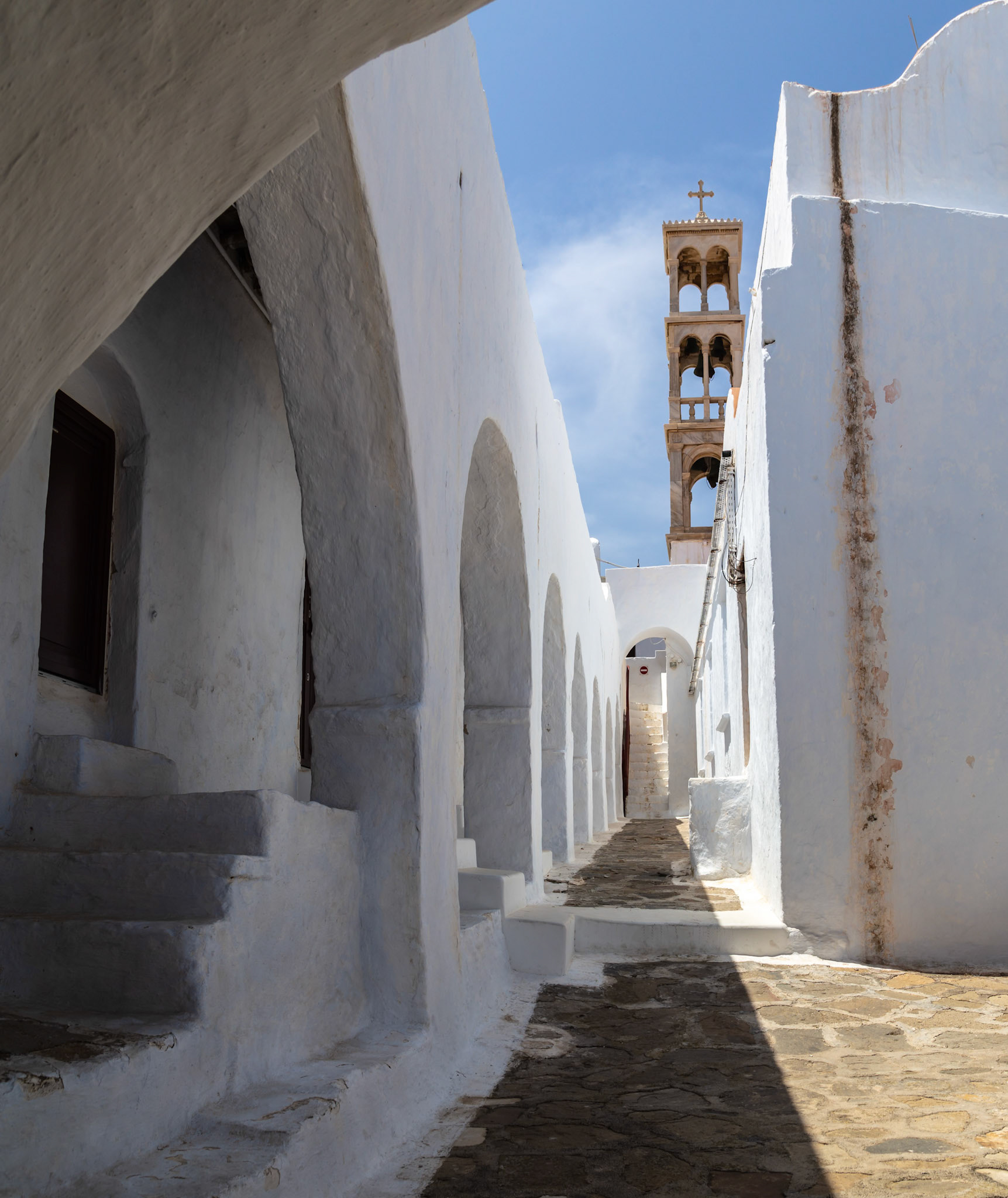 Mykonos, Greece - May 22nd 2018: A view of the Paraportiani Orthodox Church, known for its unique architecture, in Mykonos Town, Greece.