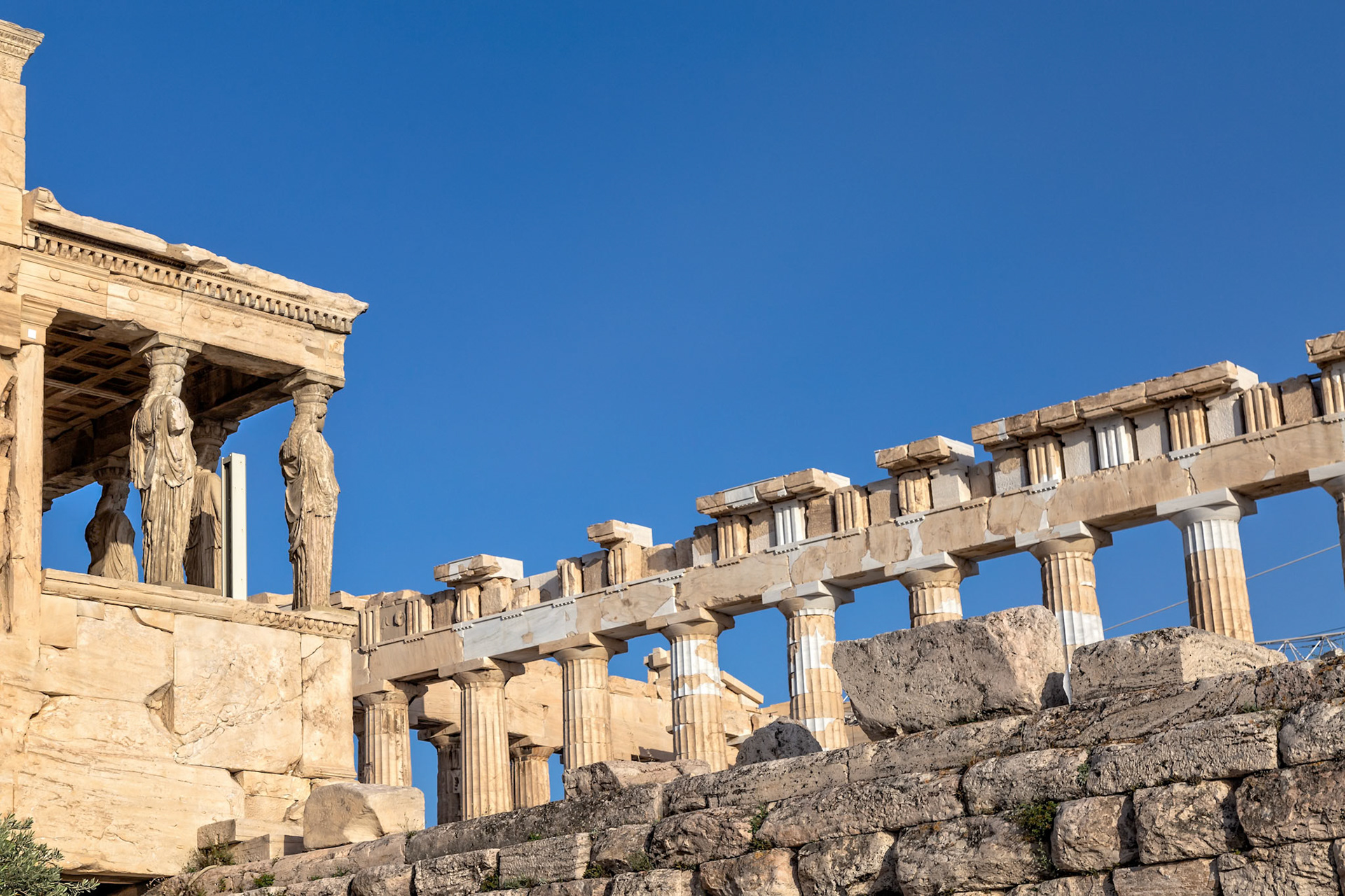 Acropolis, Athens, Greece - May 23rd 2018: The Erechtheion's Caryatids stand proudly, part of the ancient temple dedicated to Athena and Poseidon.