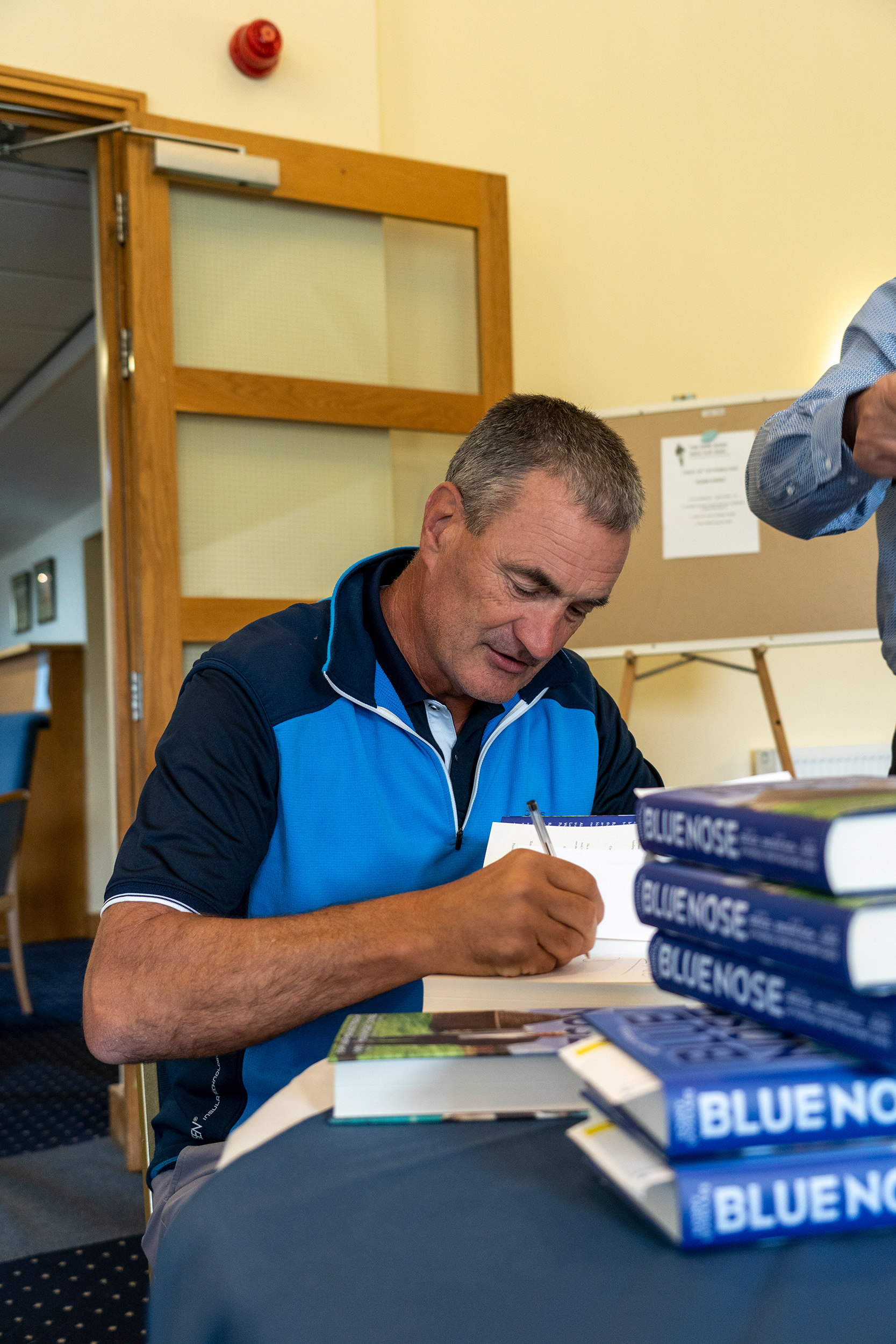 Derek Mountfield signing book
