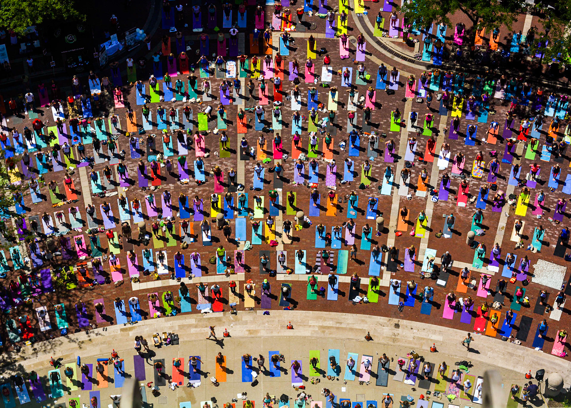 Participants of Monumental Yoga stand on their mats spaced out on Monument Circle in downtown Indianapolis, IN, June 21, 2014.