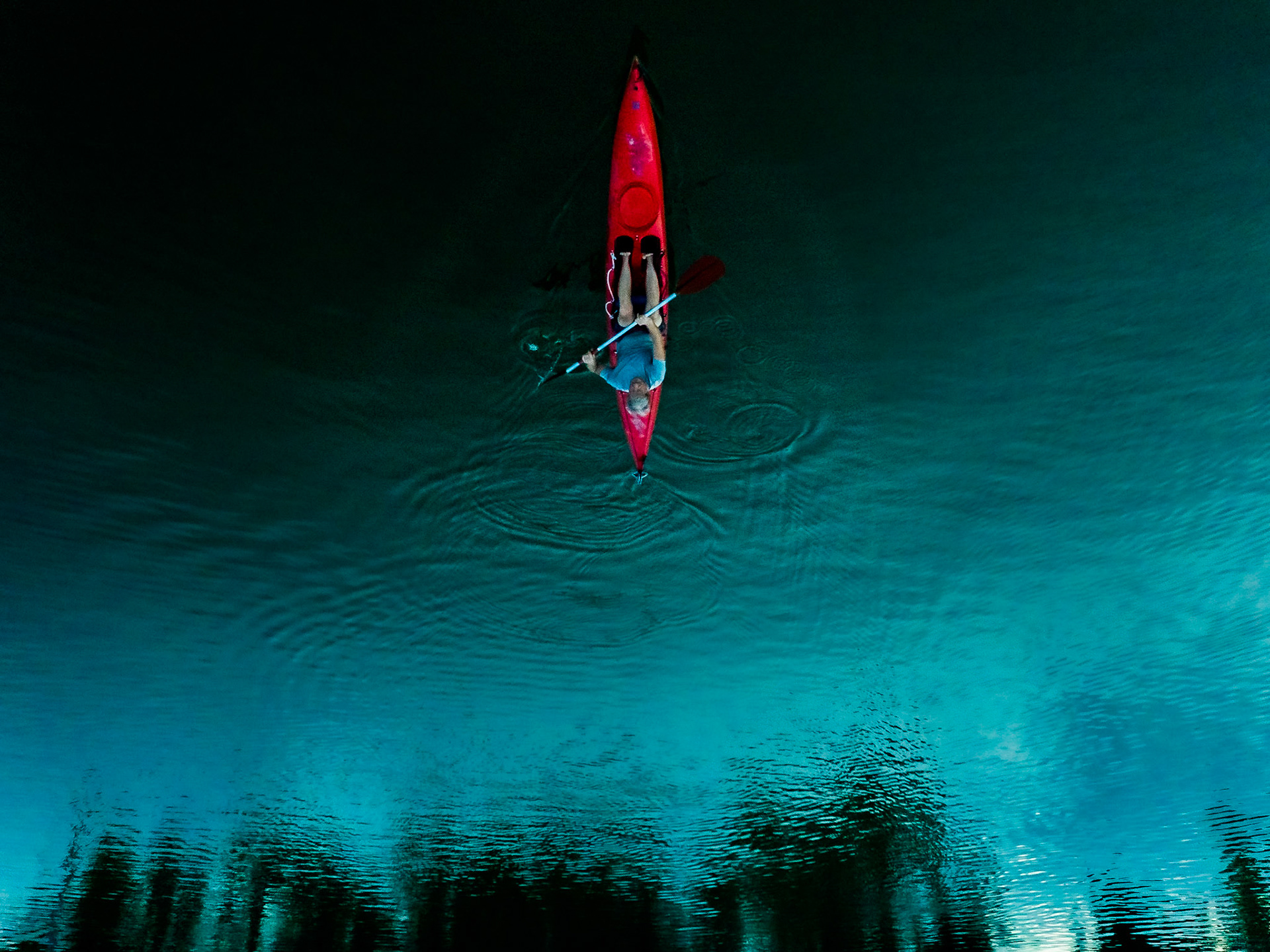 Former U.S. Olympian kayaker Steve Kelly paddles through the waters of Lake Maxinhall on the Northeast side of Indianapolis, July 14, 2020. Kelly was unable to compete in the 1980 Moscow Summer Olympics due to the U.S. boycott during the Cold War.