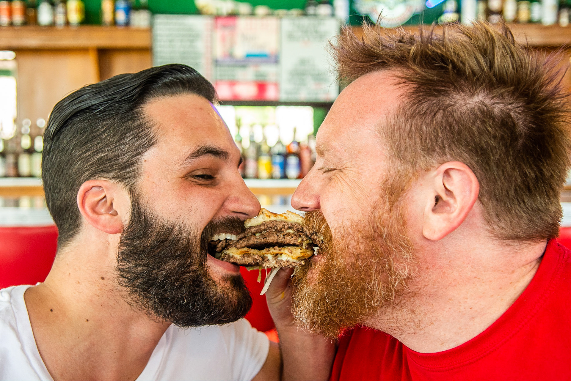 NUVO Newsweekly food journalist, Cavin Water, and restaurant owner Ed Rudisell reenact the Lady &amp; The Tramp spaghetti scene for a feature for Burger Week in the historic restaurant, Workingman's Friend, on the West side of Indianpolis, June 16, 2016.