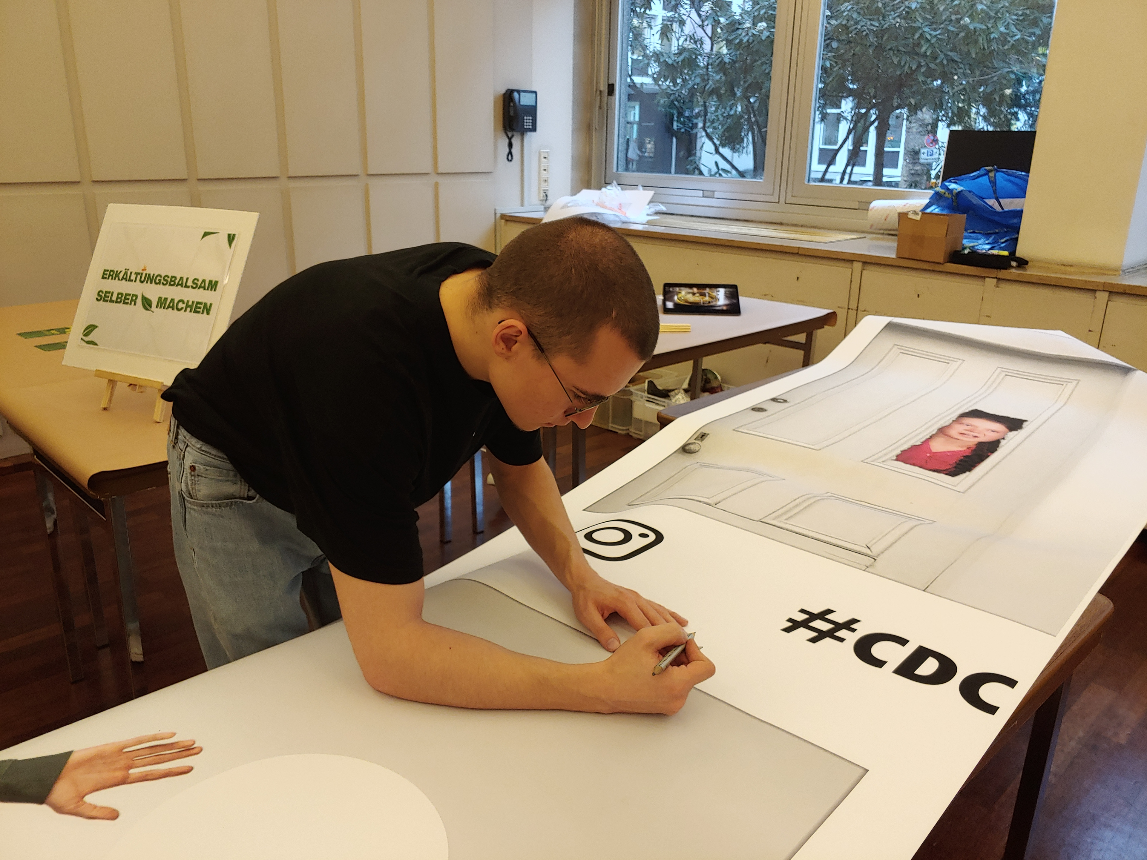Cutting the print for the booth