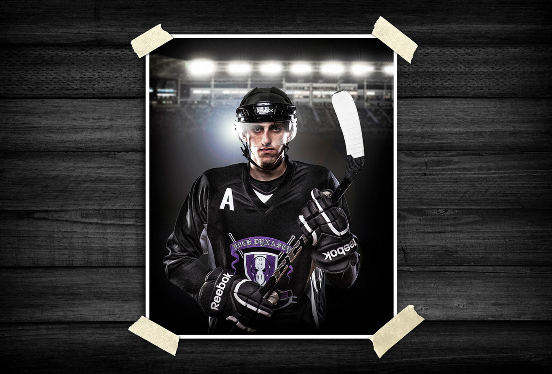 Portrait of a hockey player in full protective gear holding a hockey stick on the ice, with stadium lighting and a dramatic sports backdrop.