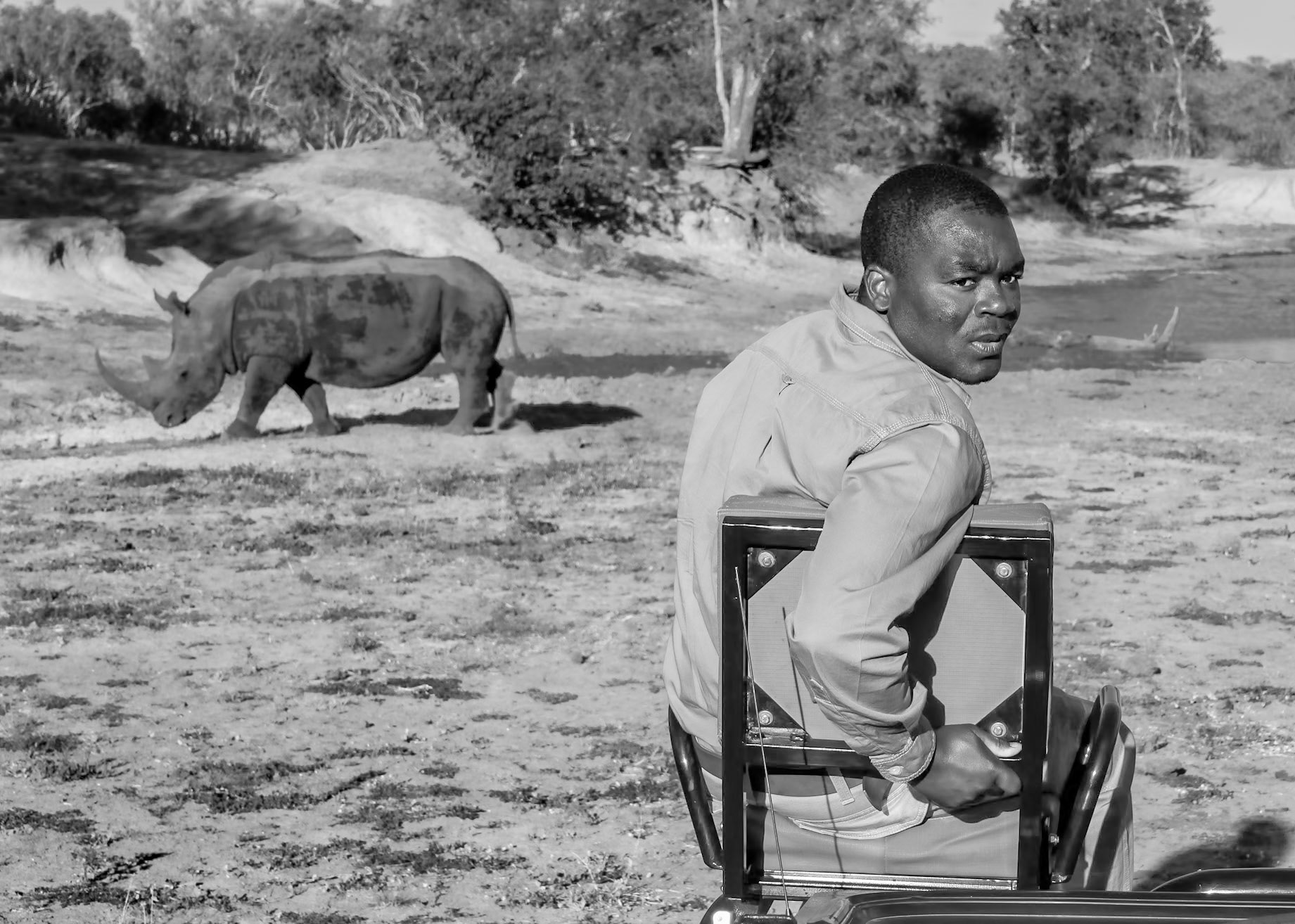 Our tracker, Simon, in ThornyBush, South Africa, checking out  "wildlife" - but it was me :-D LOLOkay - so I called his name as a distraction to create a kinda funny scene. What's life without a little bit of fun :-D