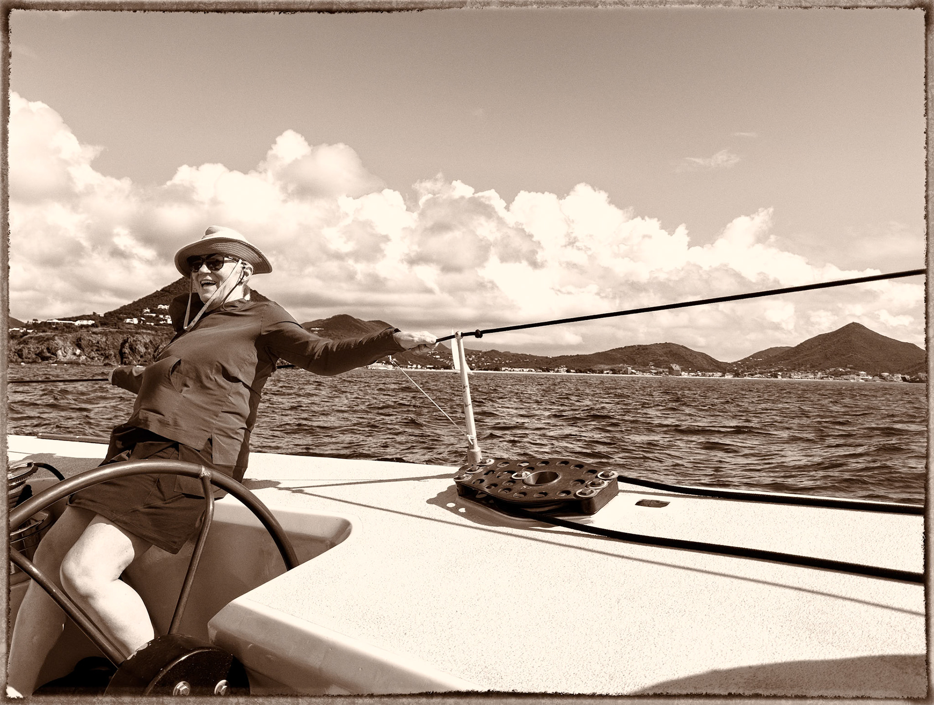 the RACE IS ON! Paula gets her first feel of sailing a 12metre yachet (or any sailing vessel for that matter) - calm and collected