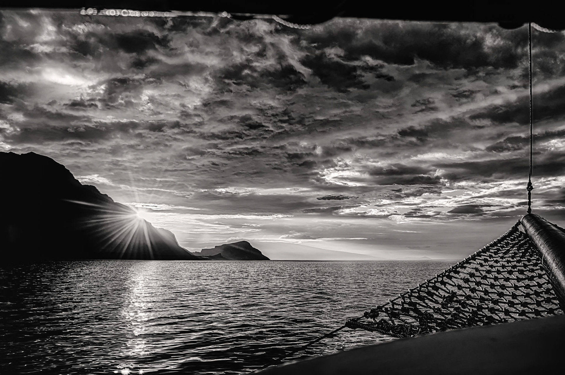 The sunrise peaks out from behind the northenr tip of Isla Isabela in the Galapsgos Islands, Ecuador.While the color version of this shot is appealing, I'm partial to this black and white version. In either case it was certainly betting up at 5am to wait for this scene as we made our was around the island.
