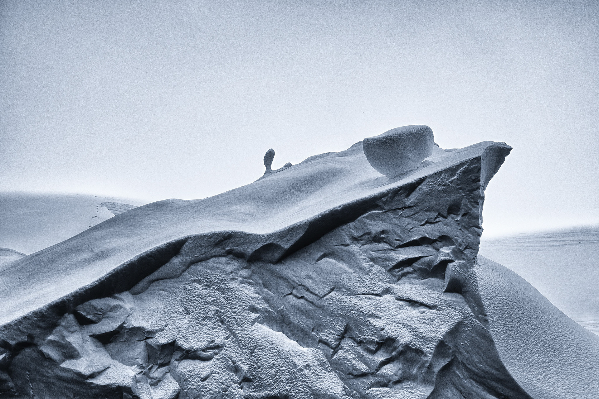 Antartic iceburg are wonderous in their miriad of formations. That single cube on the edge of tumbling reminded me of a marshmellow as we made our zodiac tour